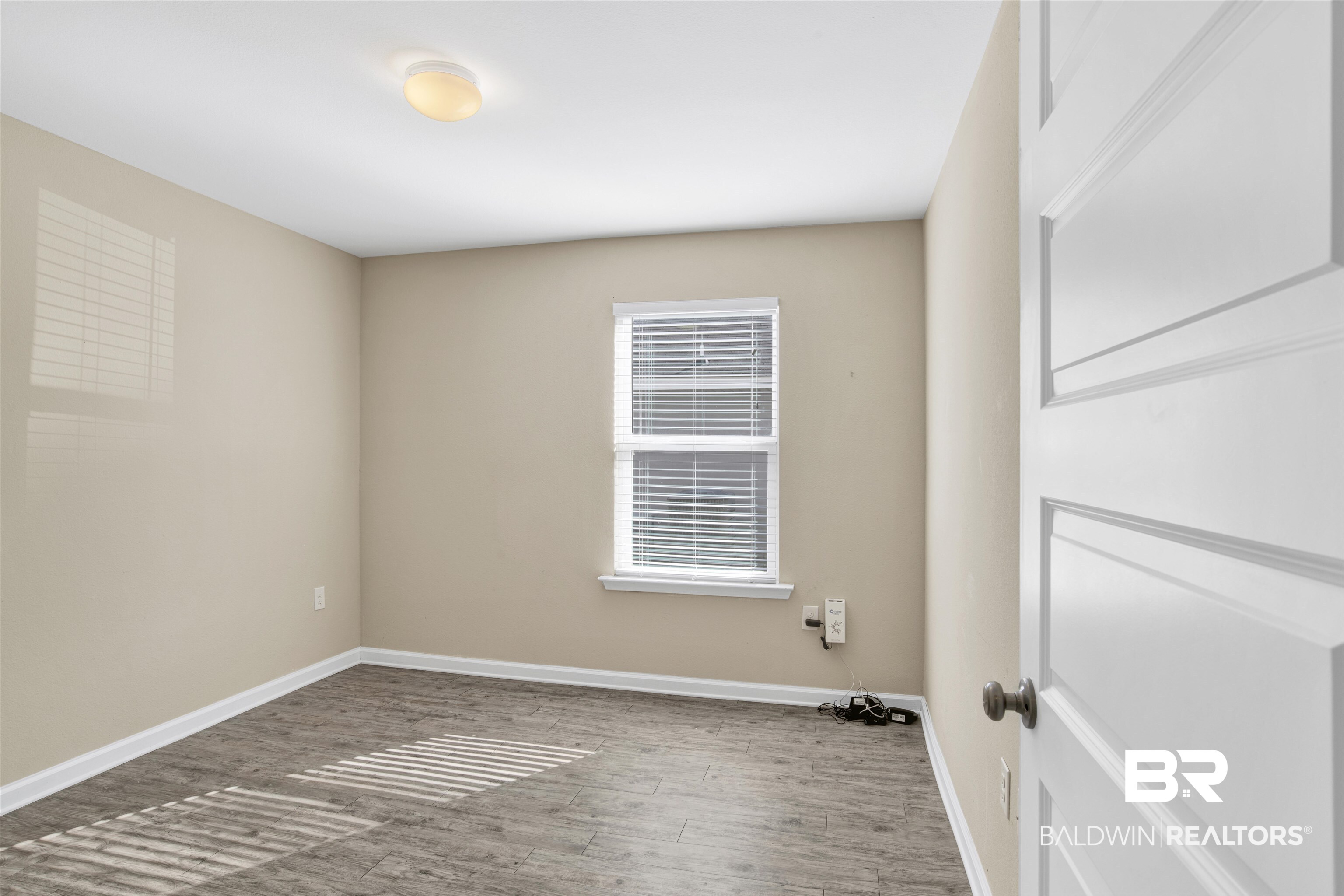 6926 Crimson Ridge Street Gulf Shores, AL 36542 - Photo 11 of 18 Laundry room with wood finished floors and baseboards