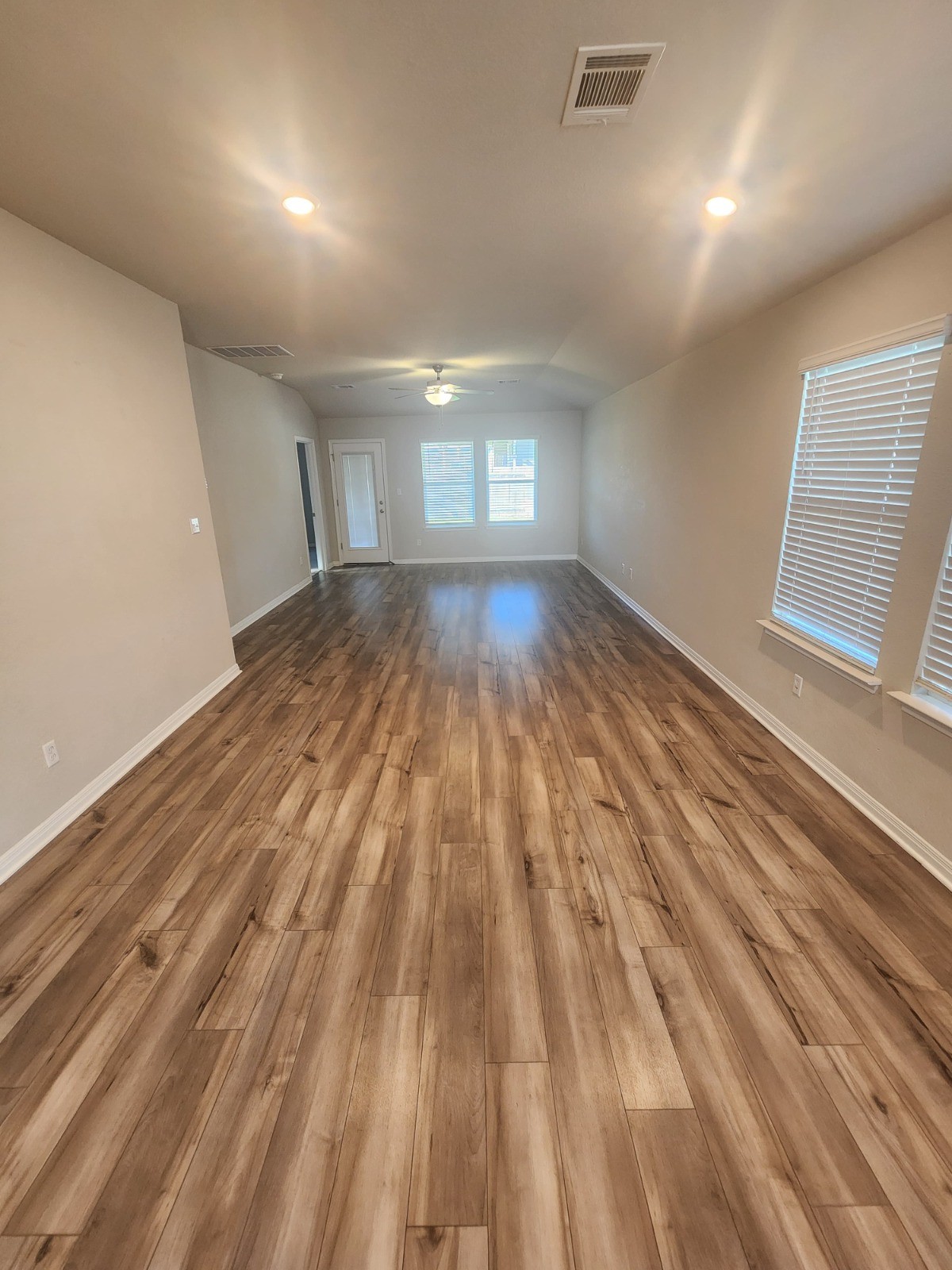 623 Sungrove Trail Georgetown, TX 78628 - Photo 6 of 17 Spare room with ceiling fan, dark wood-type flooring, and recessed lighting
