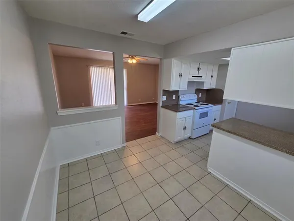 a kitchen with a sink cabinets and appliances