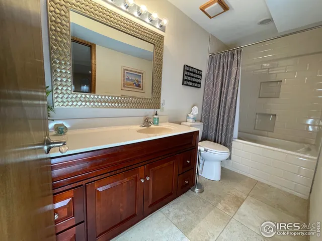 a bathroom with a sink a toilet and a bathtub