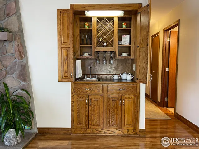 a view of front door with wooden floor