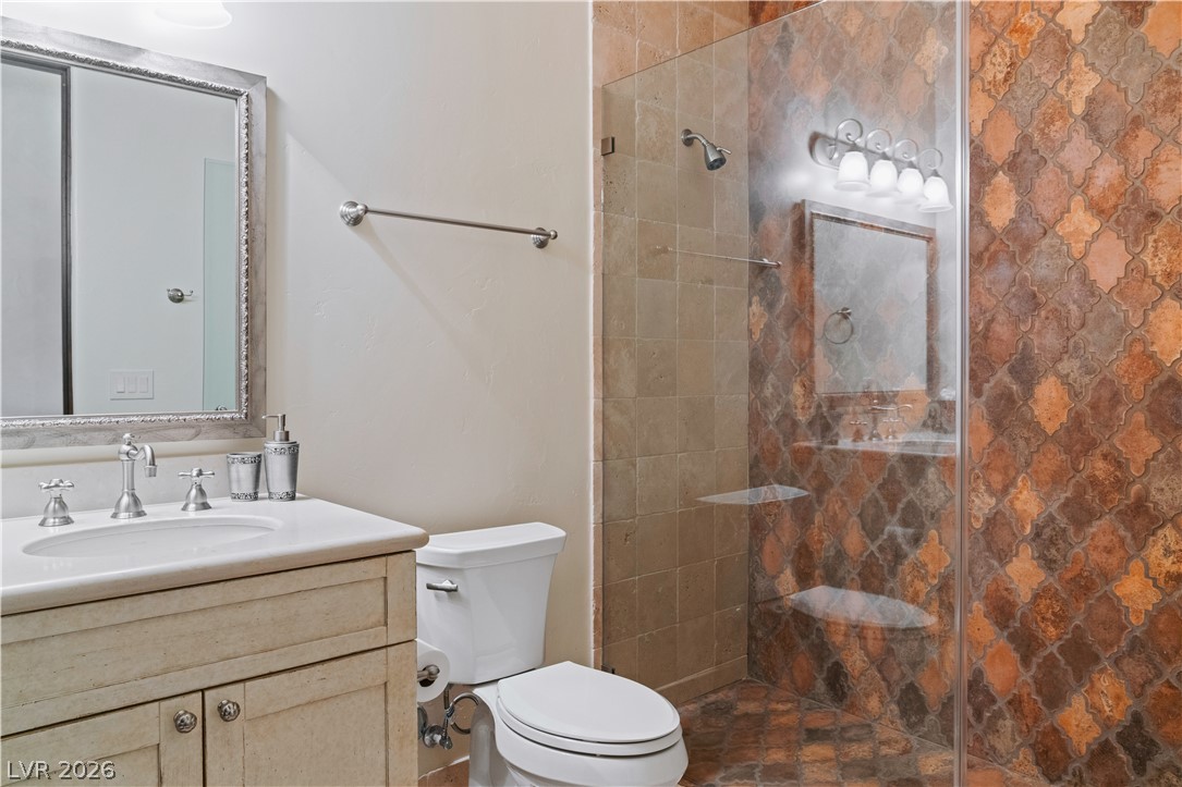 1123 Christian Road Henderson, NV 89002 - Photo 35 of 94 Elegant shower enclosure features decorative tiled walls.