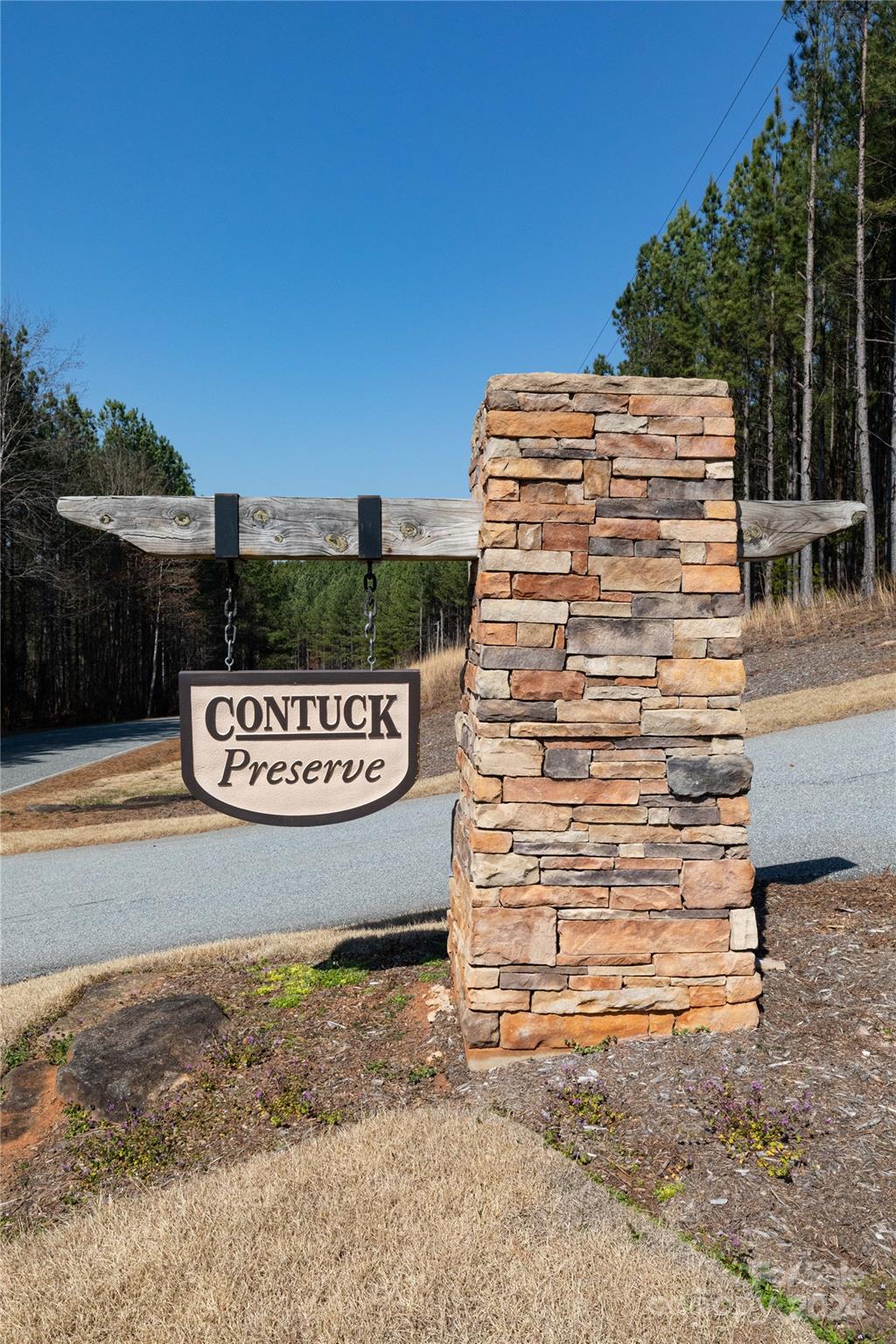 0 Contuck Ln Mill Spring, Unit 21 Mill Spring, NC 28756 - Photo 2 of 13 a view of sign board with yard