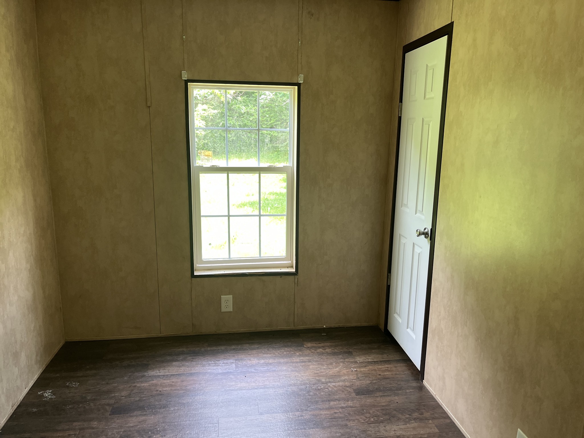 954 Normandy Road Normandy, TN 37360 - Photo 14 of 26 an empty room with wooden floor and windows