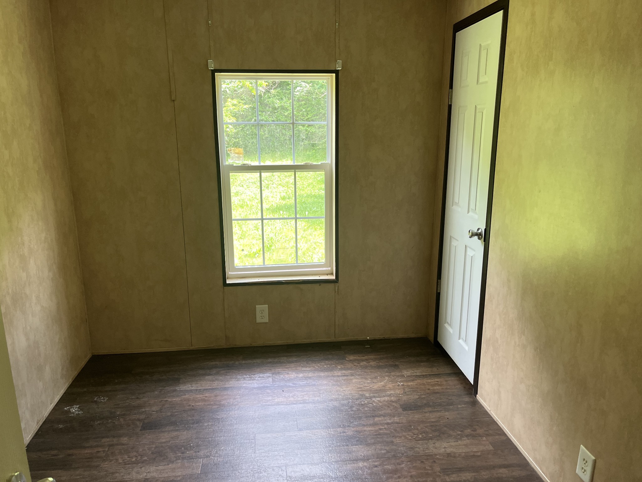 954 Normandy Road Normandy, TN 37360 - Photo 15 of 26 an empty room with wooden floor and windows