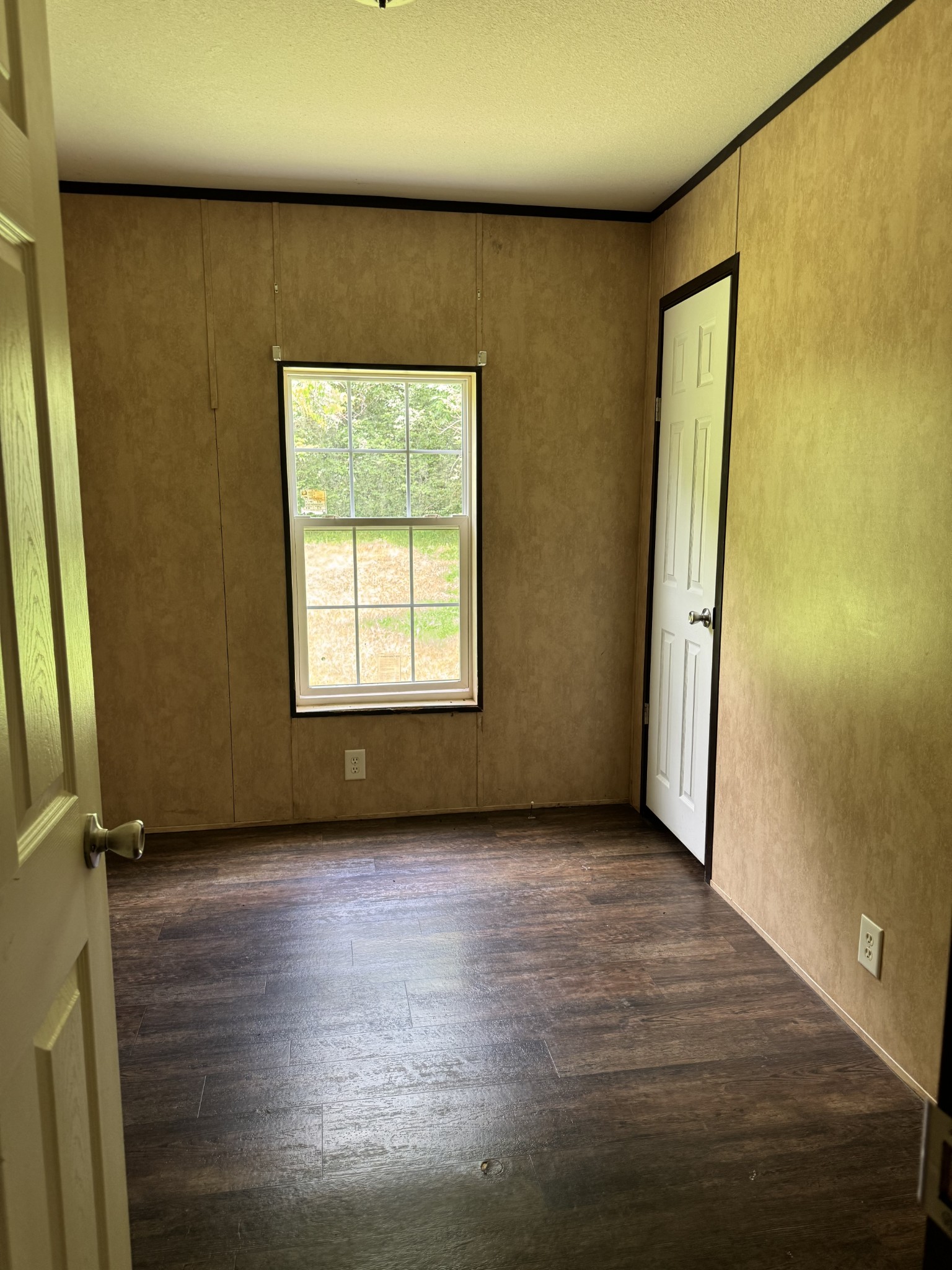 954 Normandy Road Normandy, TN 37360 - Photo 25 of 26 an empty room with wooden floor and windows