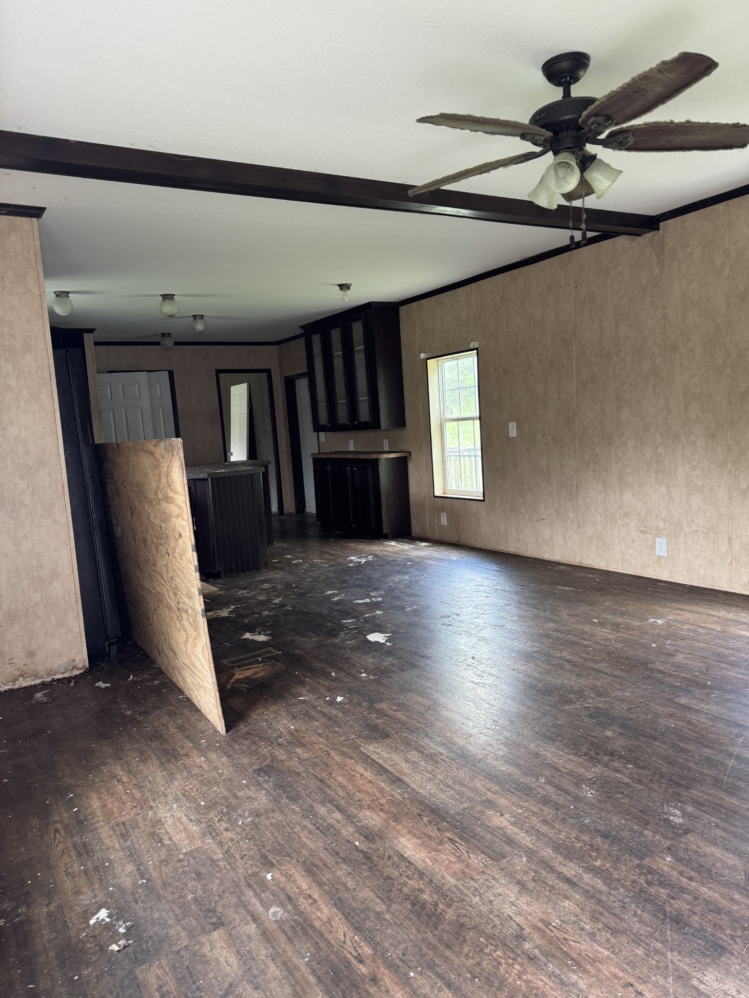 954 Normandy Road Normandy, TN 37360 - Photo 10 of 26 a view of a livingroom with a ceiling fan and wooden floor