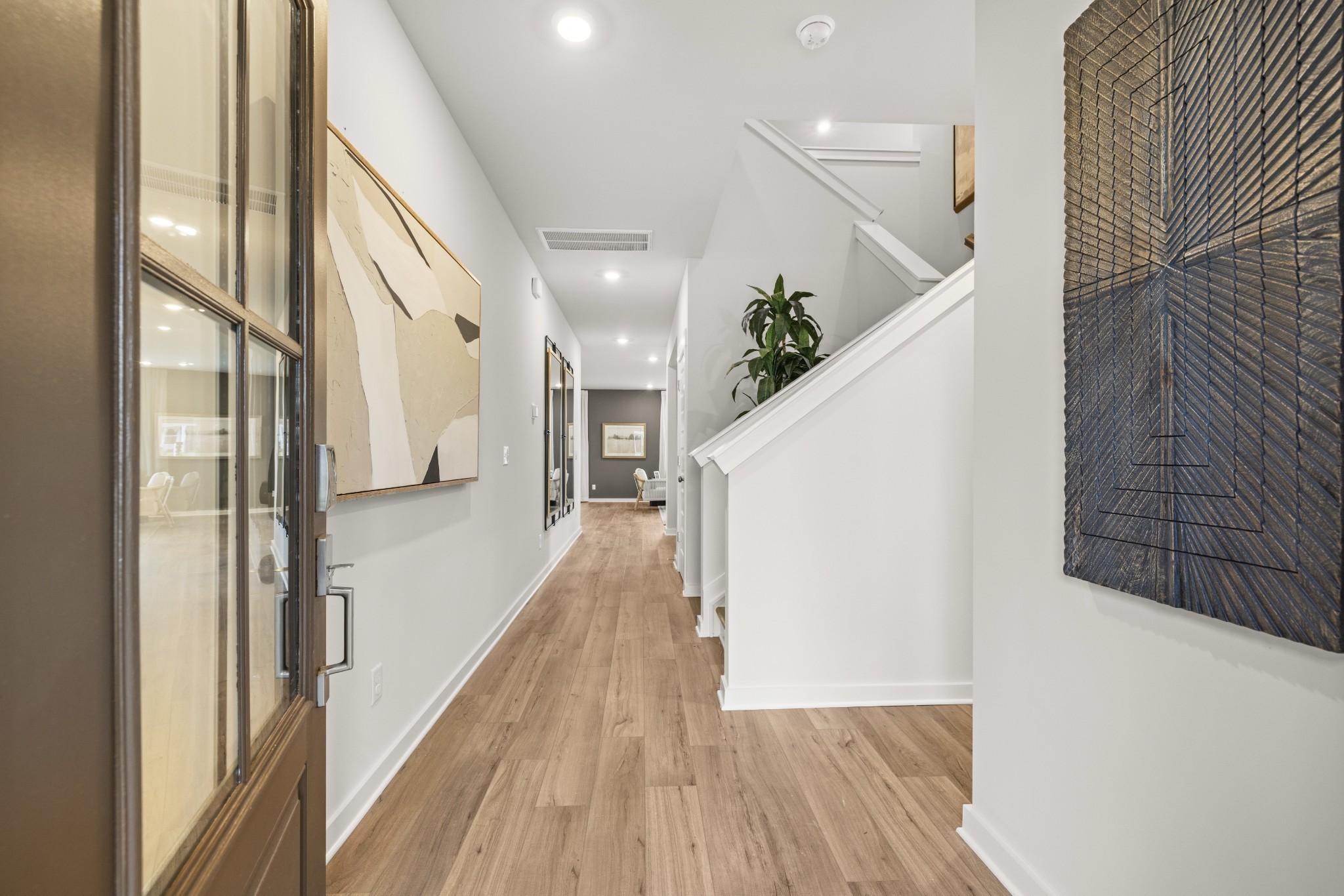 1516 Cherry Tree Lane Mount Juliet, TN 37122 - Photo 2 of 84 a view of a hallway with wooden floor and staircase