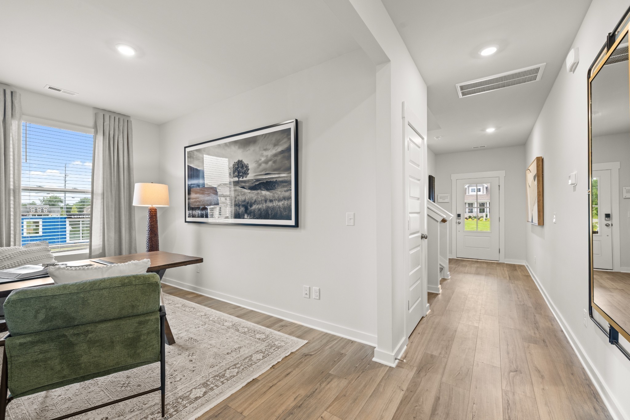 1516 Cherry Tree Lane Mount Juliet, TN 37122 - Photo 8 of 84 a view of a hallway with wooden floor and a living room