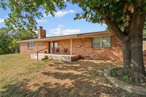 a view of house with large windows