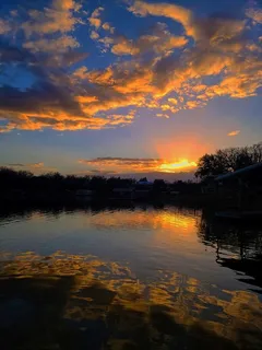 a view of lake from sunset