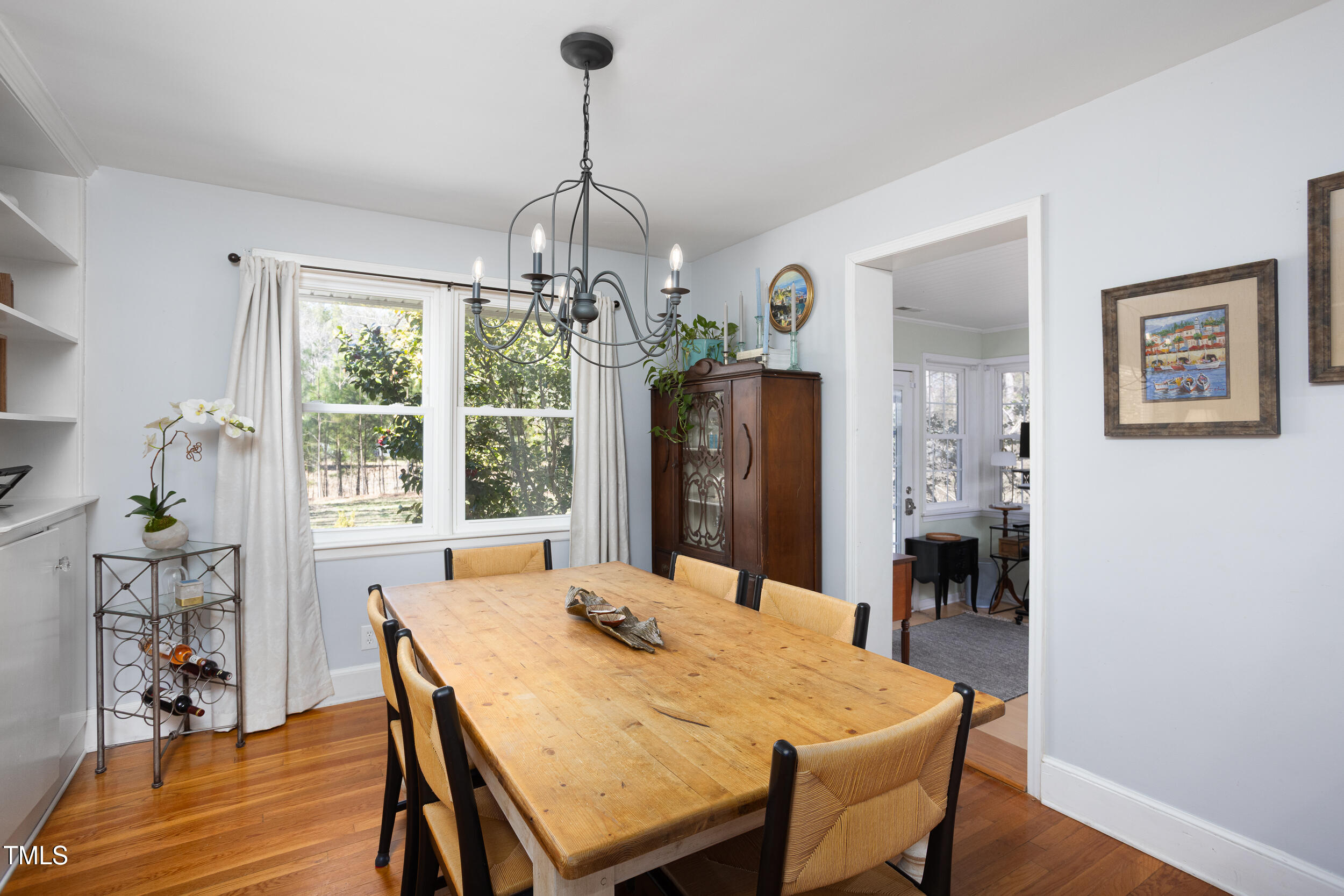 4605 Erwin Road Durham, NC 27705 - Photo 13 of 54 a view of a dining room with furniture window and wooden floor