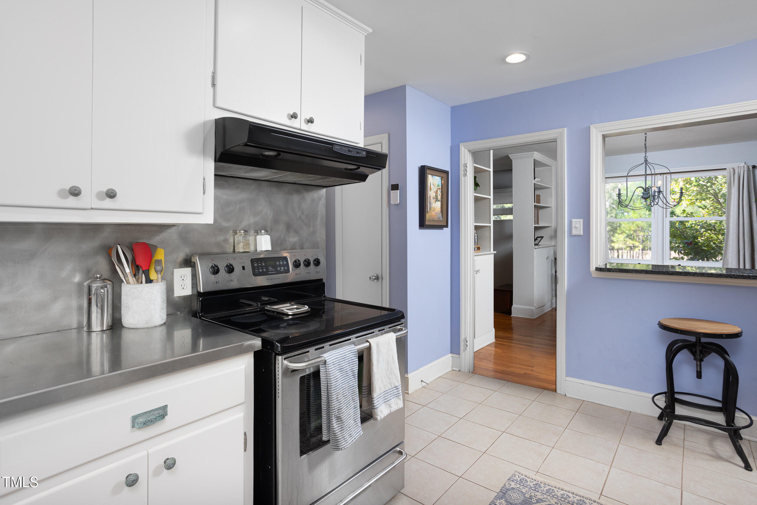 4605 Erwin Road Durham, NC 27705 - Photo 21 of 54 a kitchen with stainless steel appliances granite countertop a sink stove and refrigerator