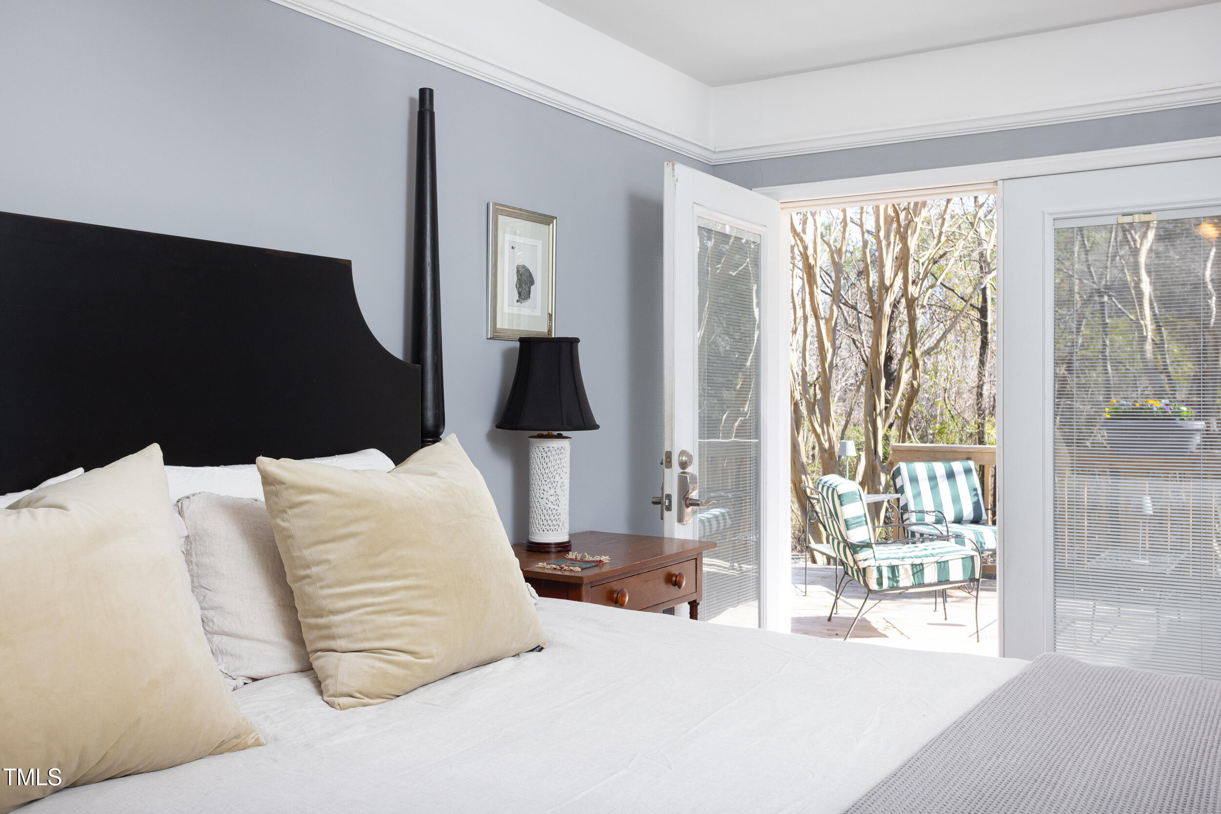 4605 Erwin Road Durham, NC 27705 - Photo 25 of 54 a bedroom with bed and large window