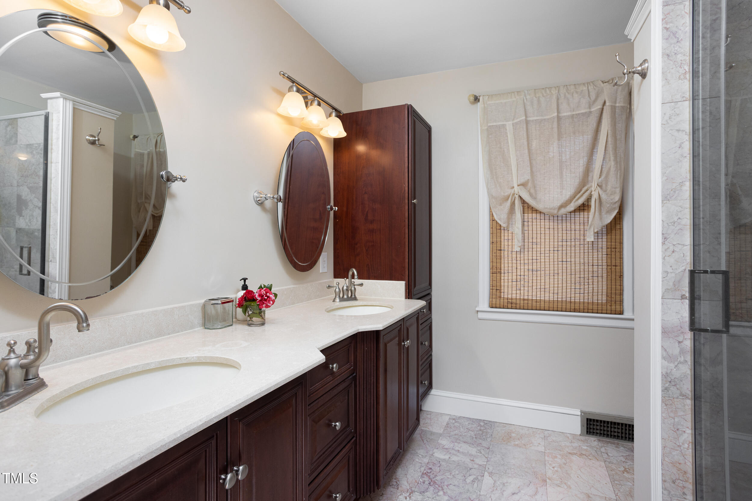 4605 Erwin Road Durham, NC 27705 - Photo 27 of 54 a bathroom with a double vanity sink mirror and double