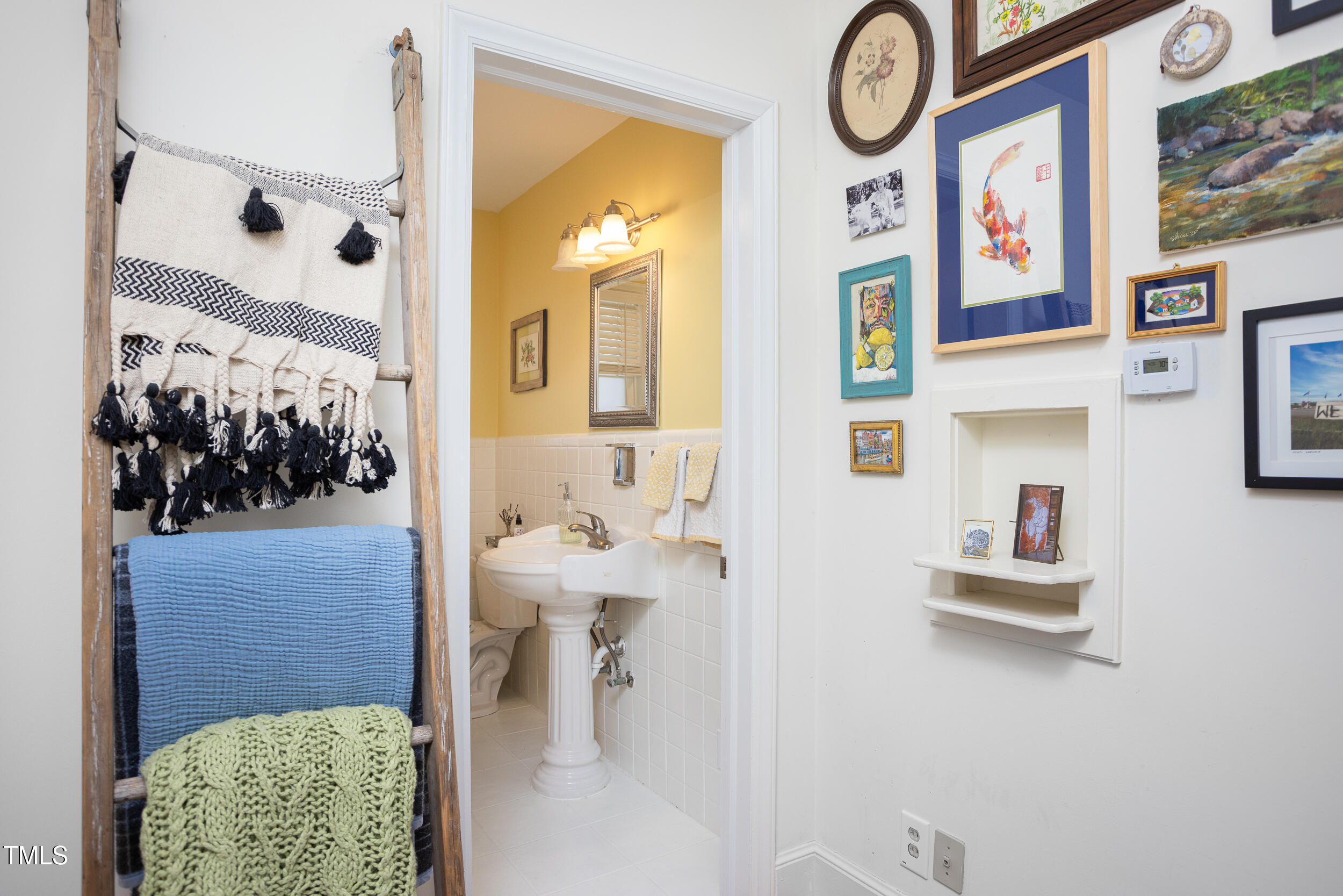 4605 Erwin Road Durham, NC 27705 - Photo 28 of 54 a bathroom with a bathtub and a painting on the wall