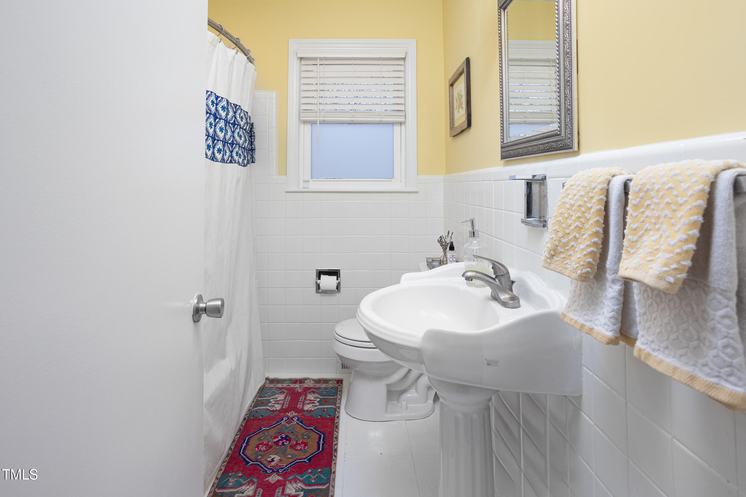 4605 Erwin Road Durham, NC 27705 - Photo 32 of 54 a bathroom with a sink and a mirror