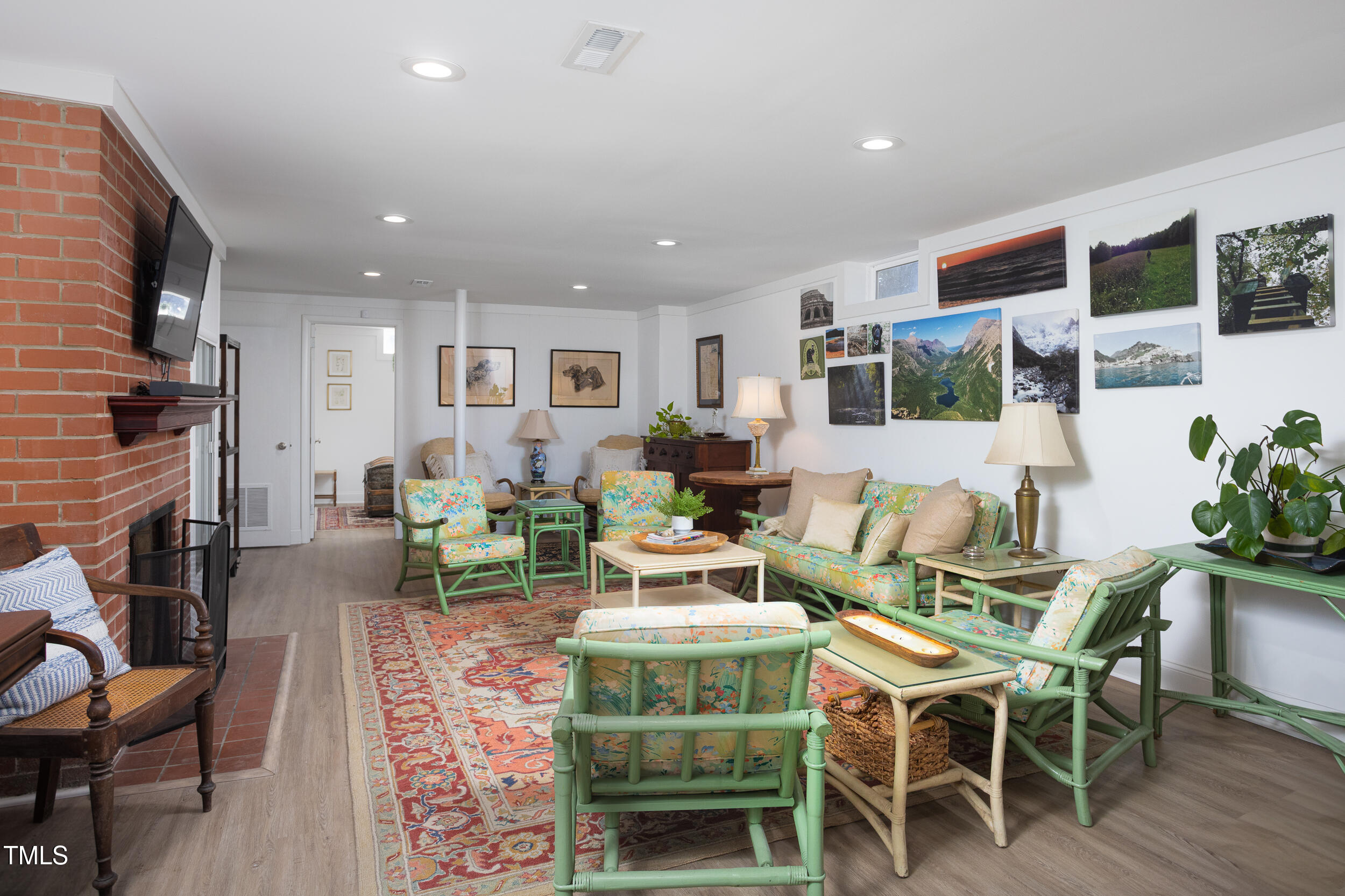 4605 Erwin Road Durham, NC 27705 - Photo 33 of 54 a living room with fireplace furniture and a flat screen tv