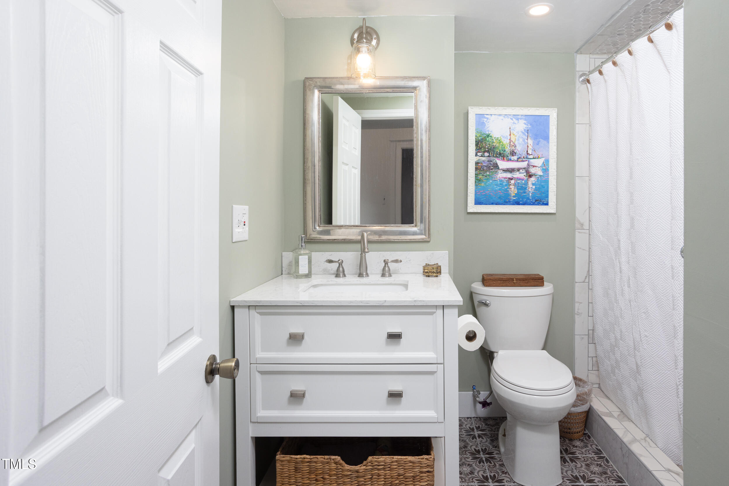 4605 Erwin Road Durham, NC 27705 - Photo 39 of 54 a bathroom with a sink a toilet and a mirror