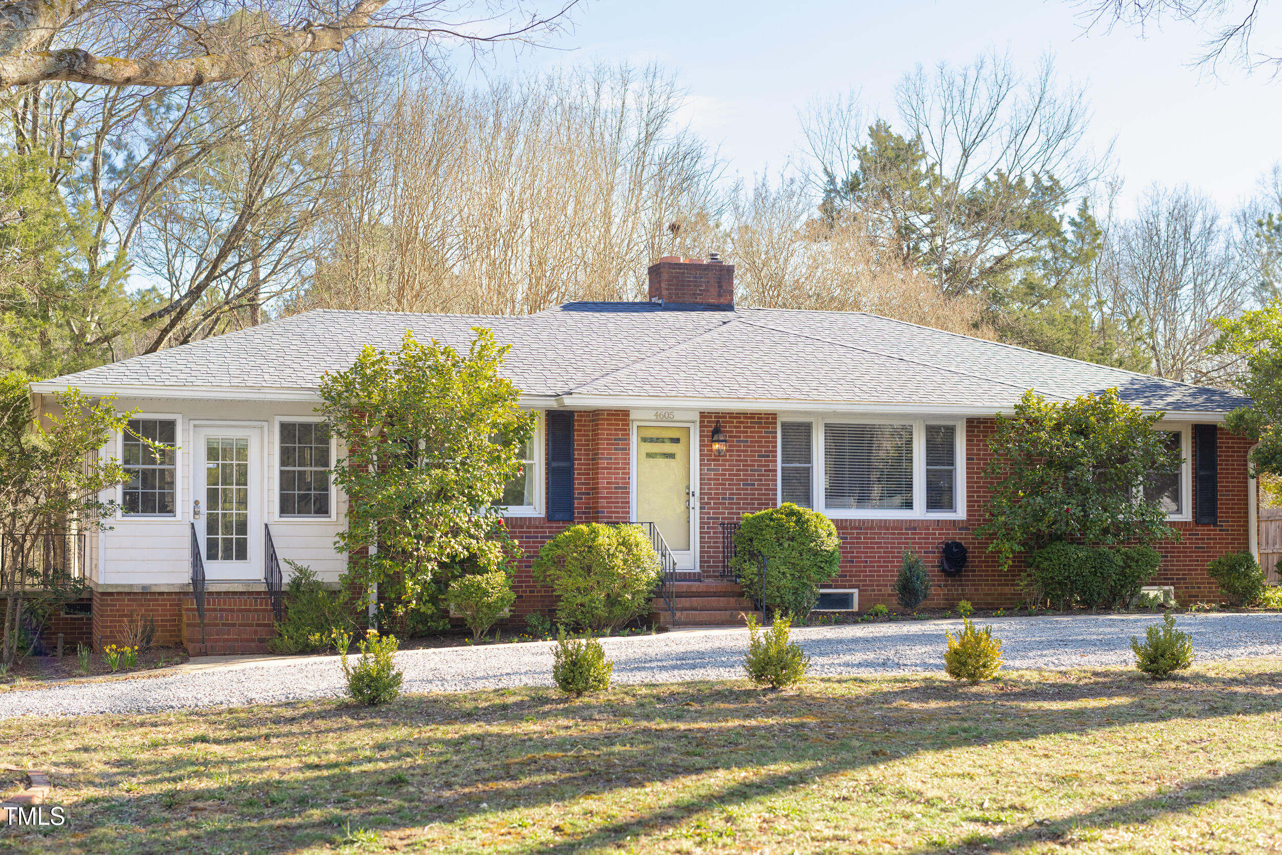 4605 Erwin Road Durham, NC 27705 - Photo 3 of 54 a front view of a house with garden and plants
