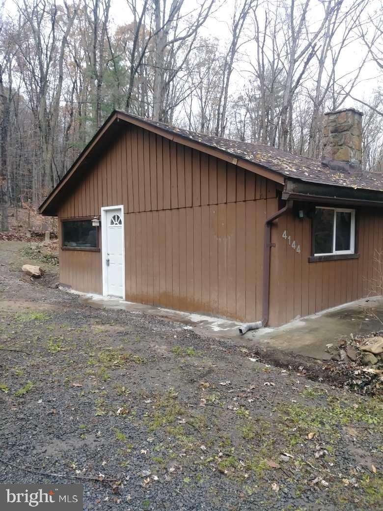 4144 Cold Run Valley Road Berkeley Springs, WV 25411 - Photo 27 of 34 EXTERIOR BY DRIVEWAY