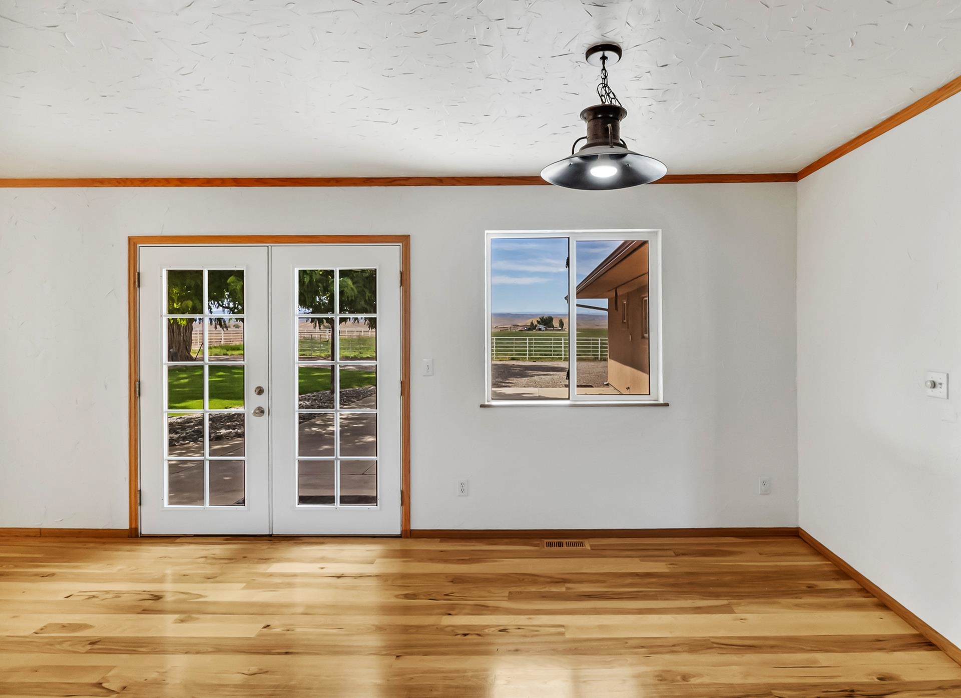 1847 7 Road Mack, CO 81525 - Photo 11 of 42 a view of empty room with wooden floor and fan