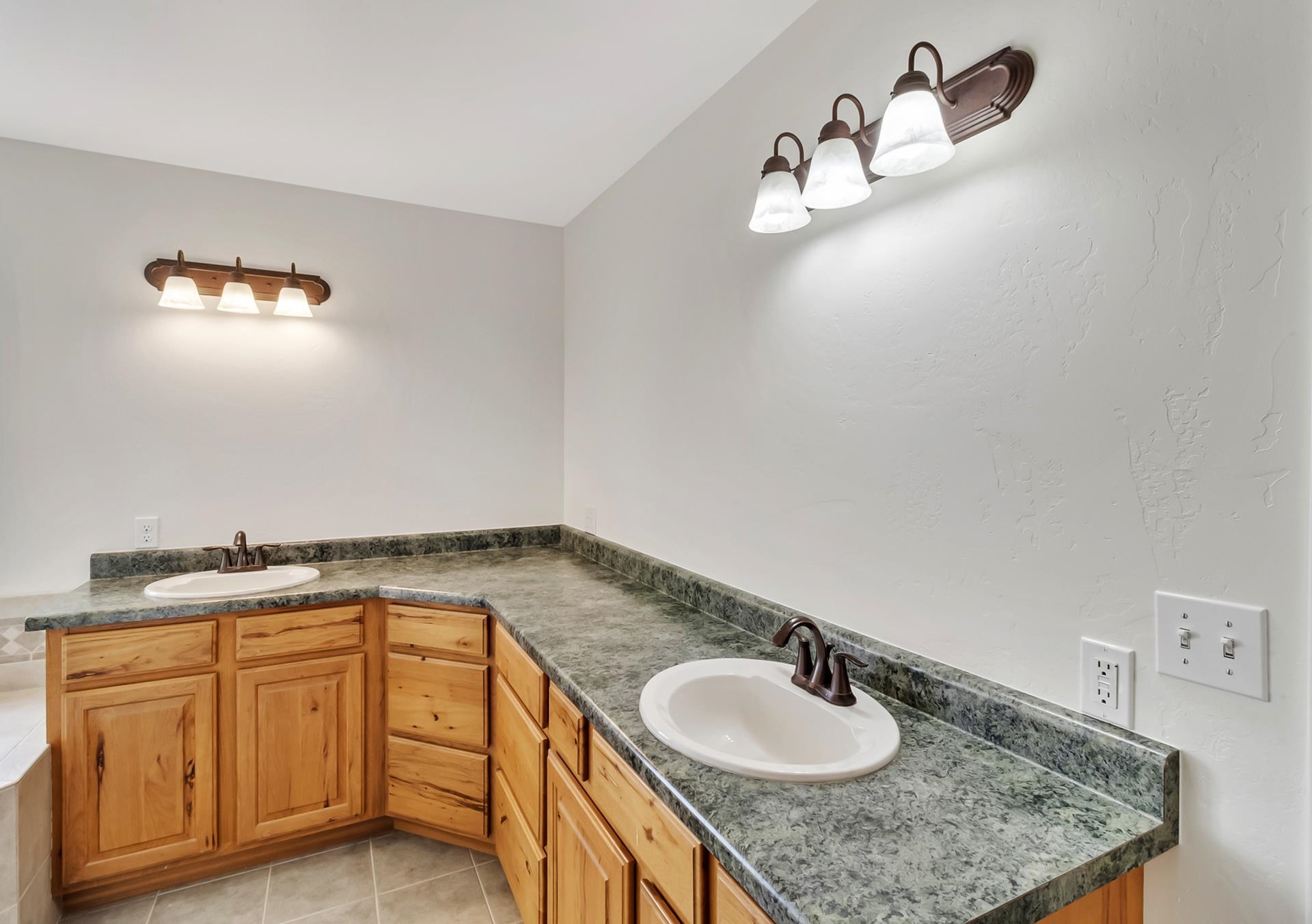 1847 7 Road Mack, CO 81525 - Photo 17 of 42 a bathroom with a granite countertop sink and a mirror