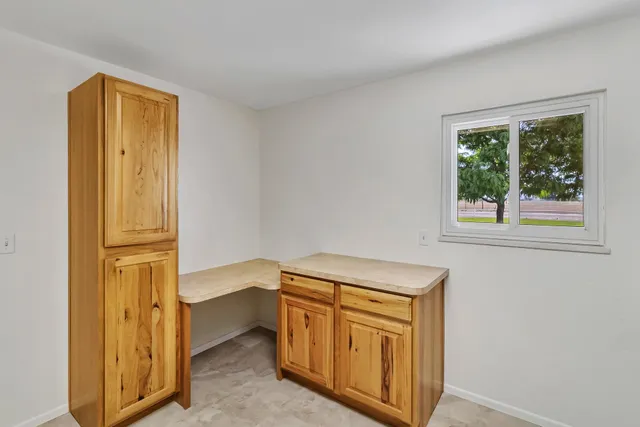 a view of walk in closet with empty room