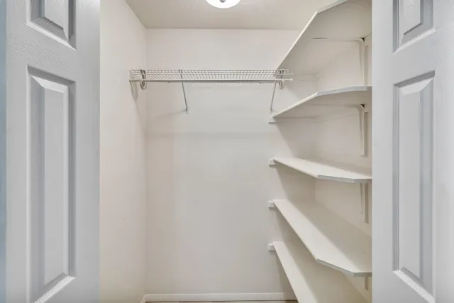 a view of an empty walk in closet