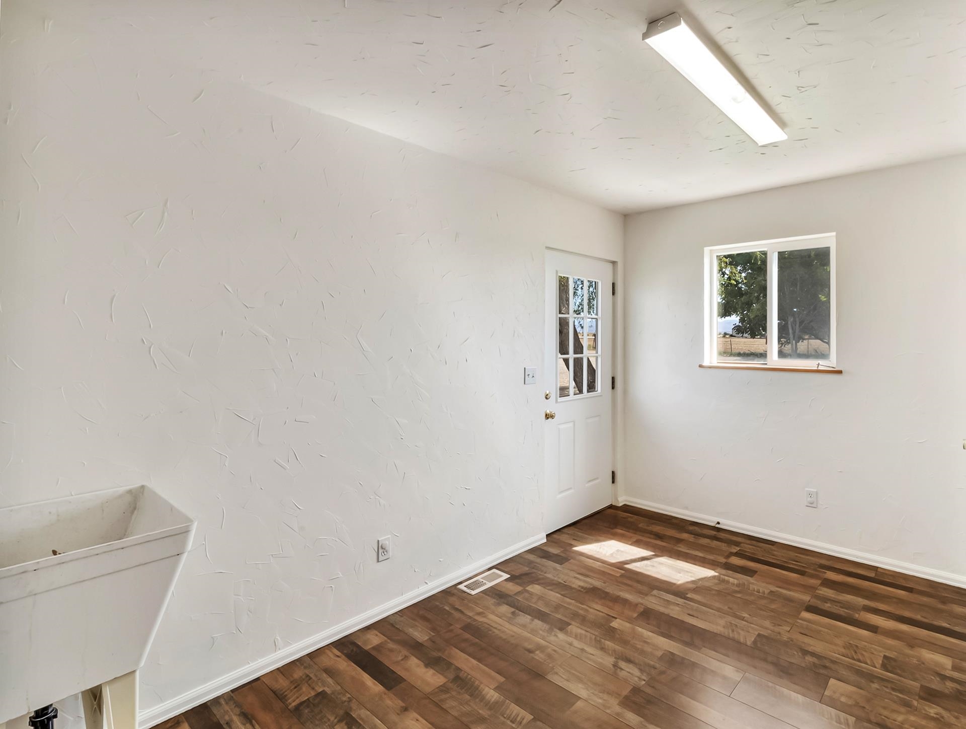 1847 7 Road Mack, CO 81525 - Photo 26 of 42 a view of empty room with wooden floor and fan