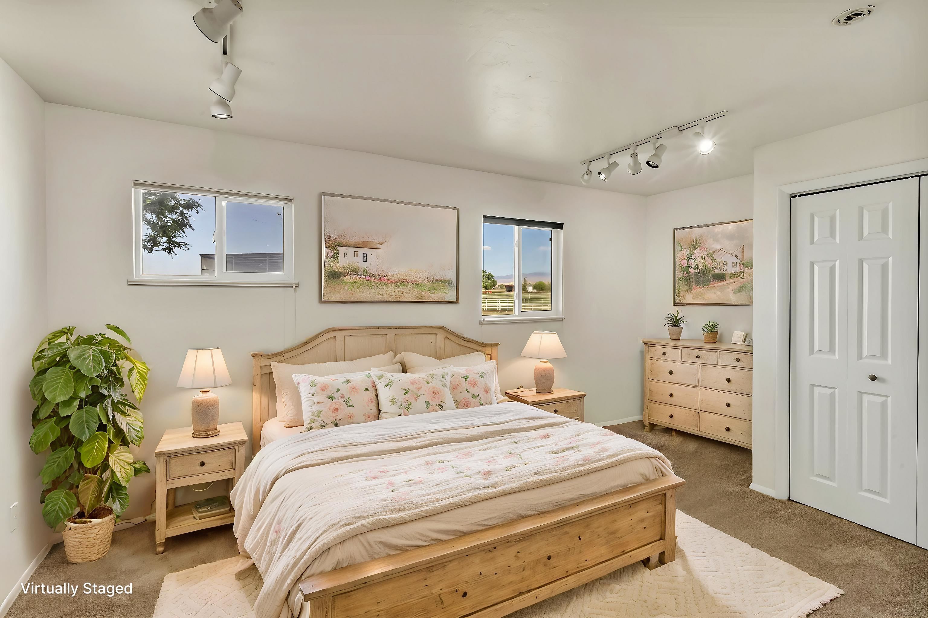1847 7 Road Mack, CO 81525 - Photo 29 of 42 a bedroom with a bed and paintings on the wall
