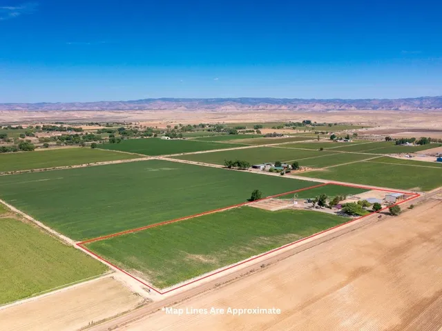 a view of a green field with clear sky