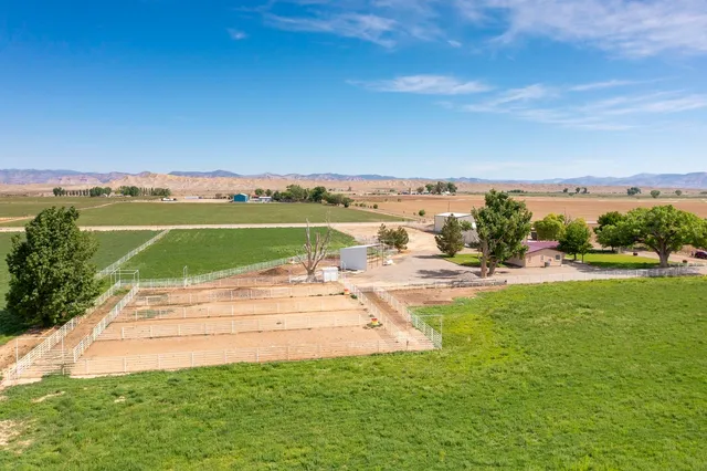an aerial view of a house with a ocean view