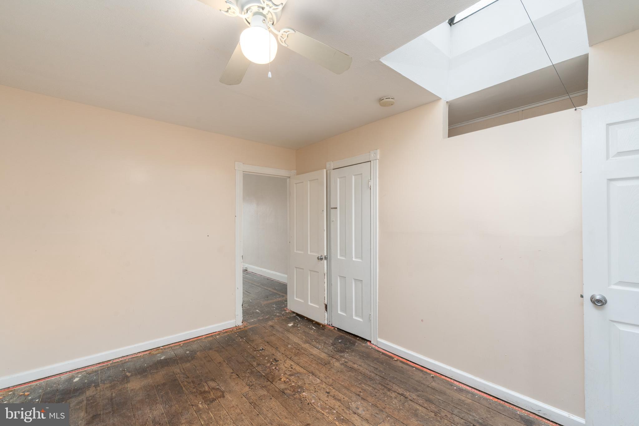 514 Brunswick Street Baltimore, MD 21223 - Photo 17 of 26 wooden floor in an empty room