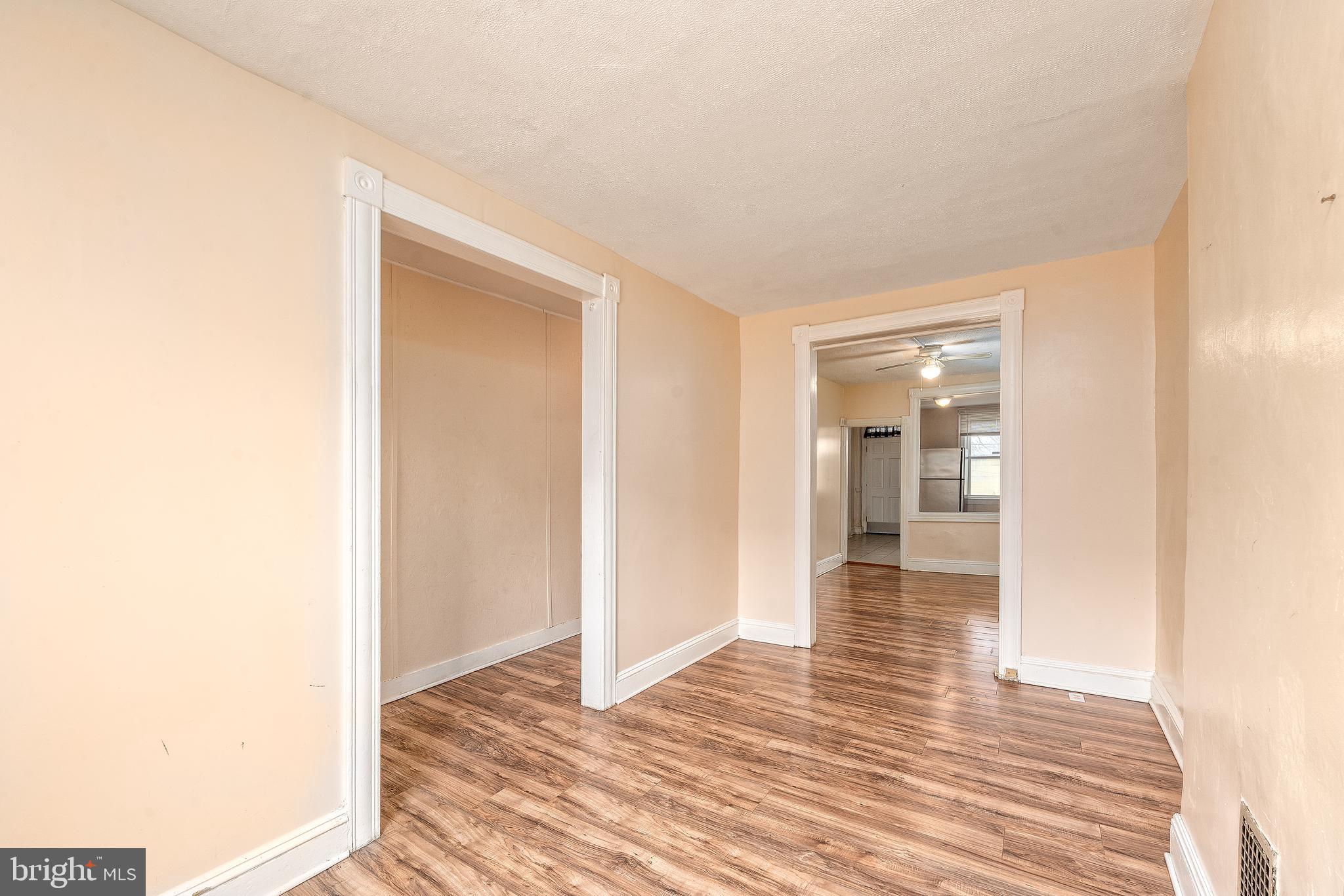 514 Brunswick Street Baltimore, MD 21223 - Photo 2 of 26 a view of a hallway with wooden floor
