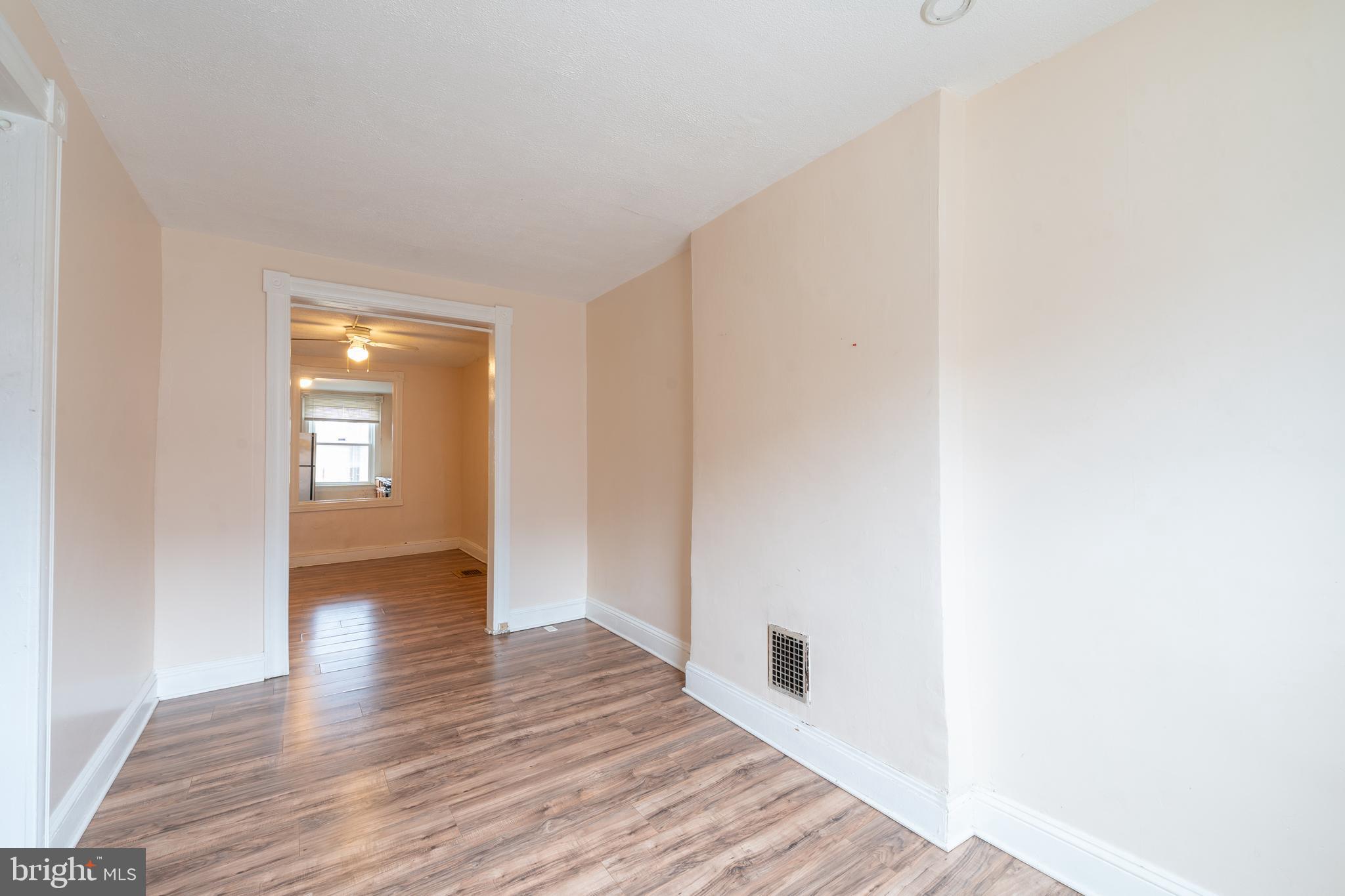514 Brunswick Street Baltimore, MD 21223 - Photo 4 of 26 a view of a hallway with wooden floor