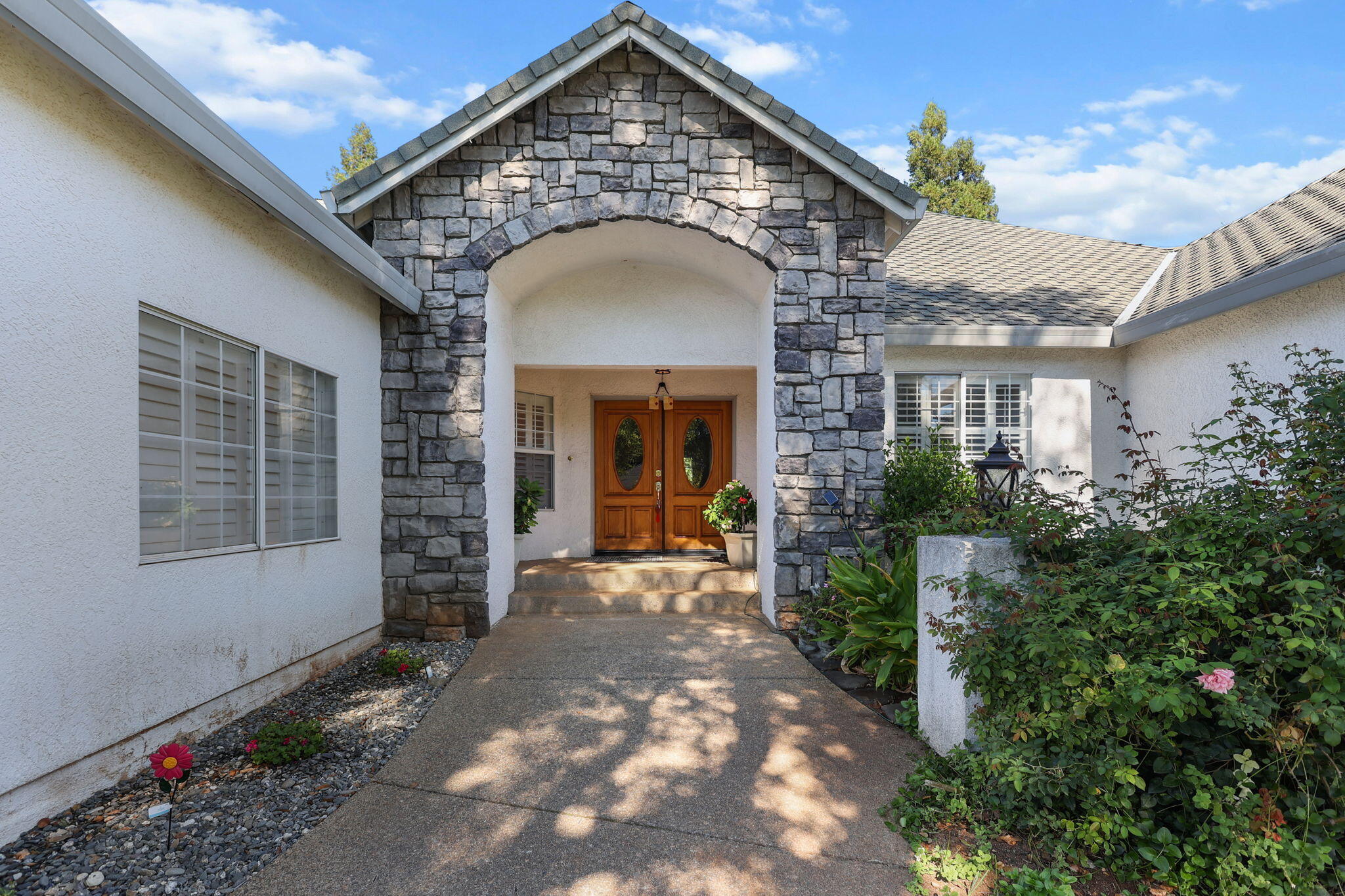 2366 Templeton Drive Redding, CA 96002 - Photo 2 of 54 a front view of a house with a porch