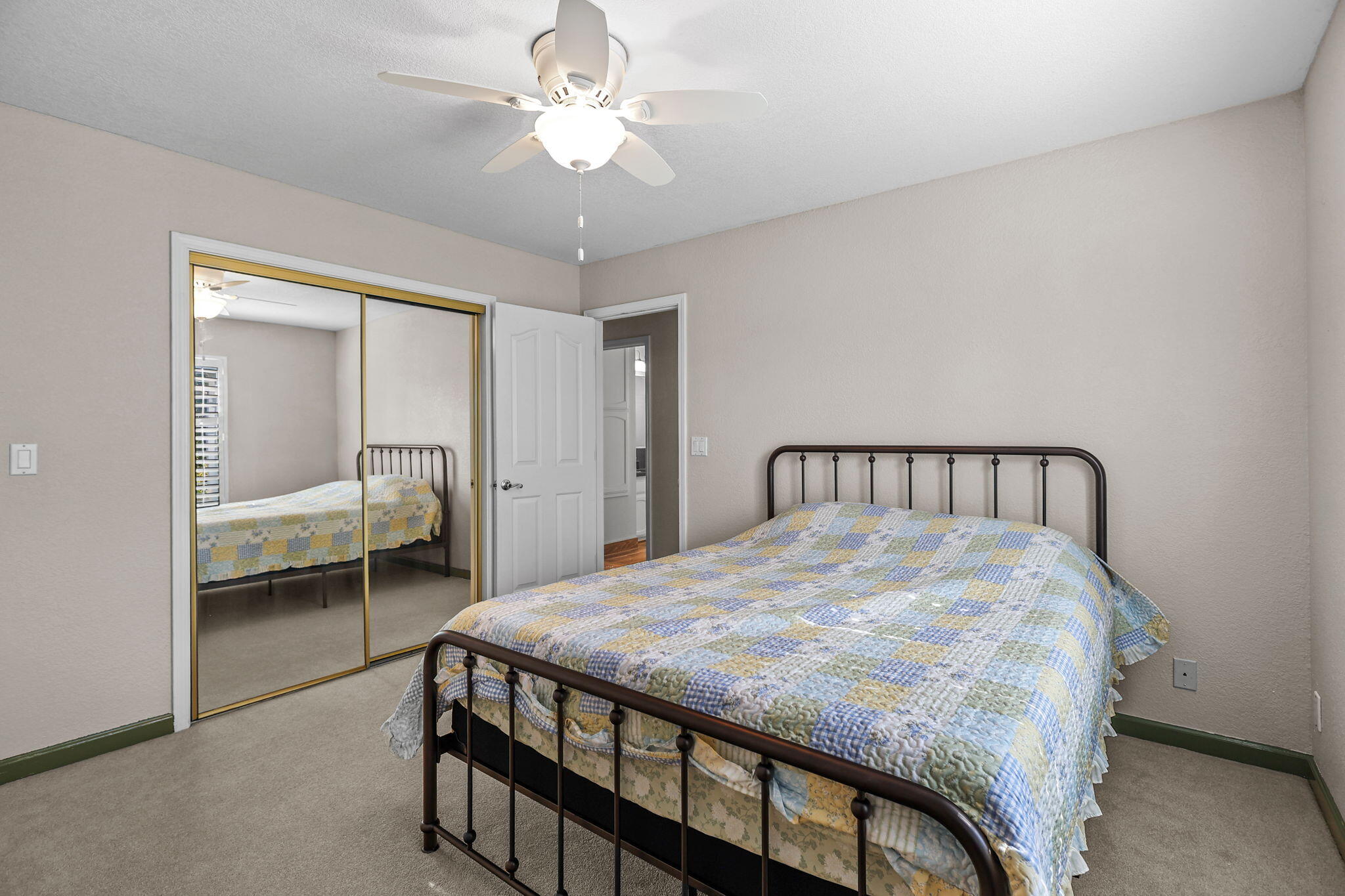 2366 Templeton Drive Redding, CA 96002 - Photo 28 of 54 a bedroom with a bed and a chandelier