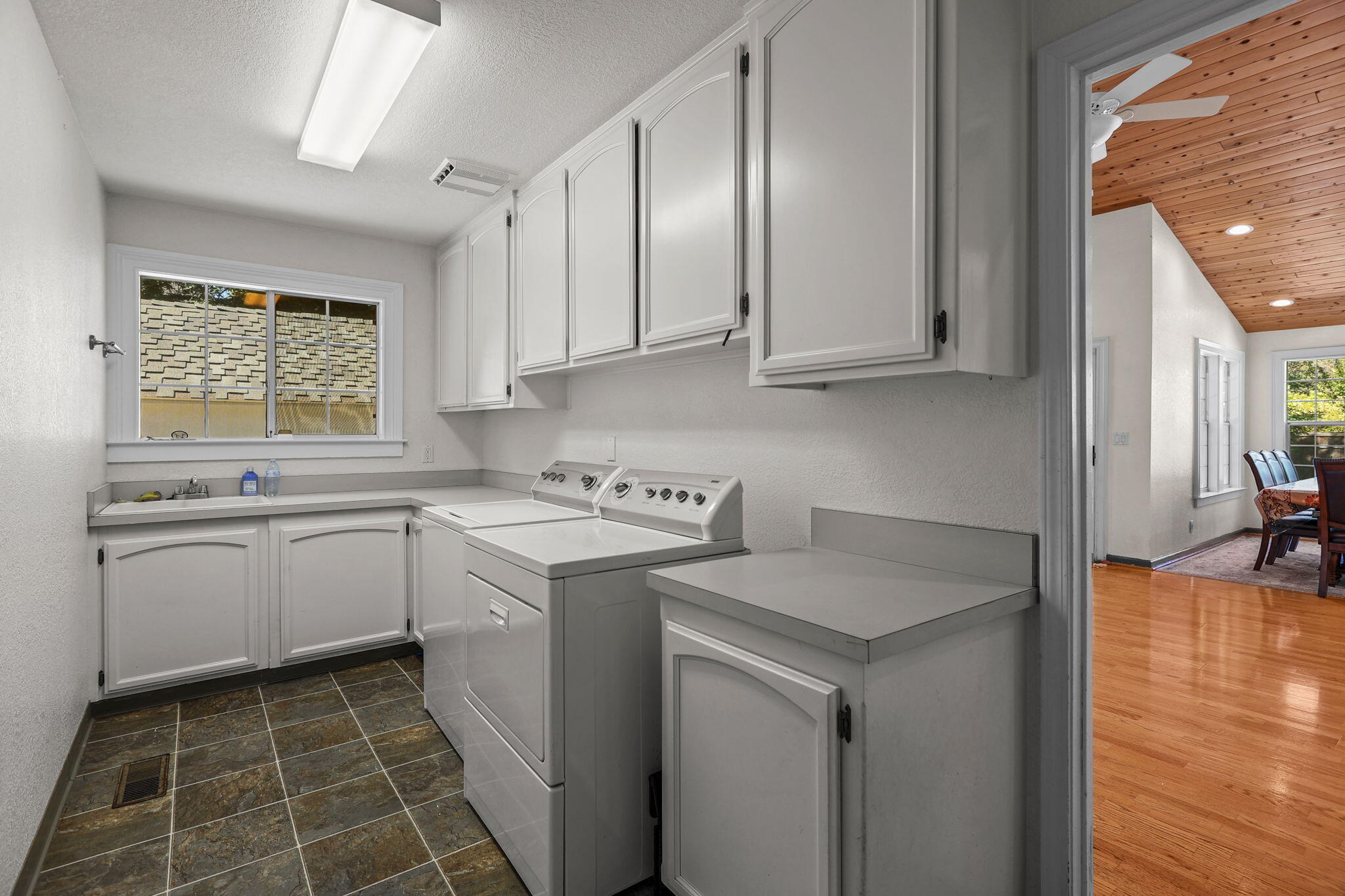 2366 Templeton Drive Redding, CA 96002 - Photo 37 of 54 a utility room with cabinets washer and dryer