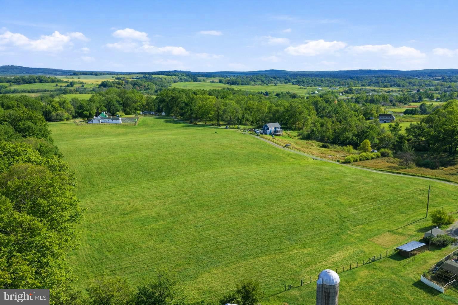 Lot A Trasara Road Rapidan, VA 22733 - Photo 13 of 17 a view of a lush green outdoor space with a swimming pool and valleys in the background