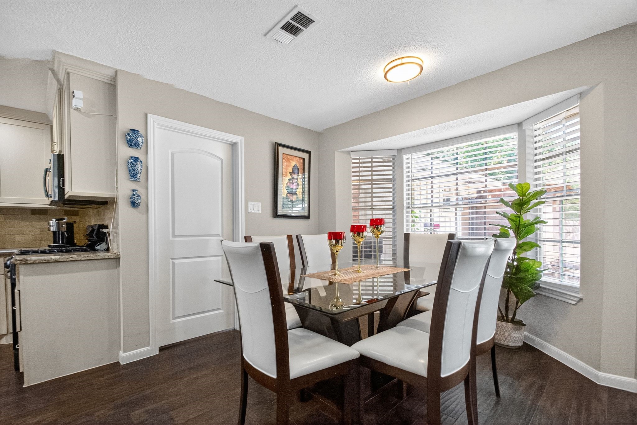 2514 Creekleaf Road Houston, TX 77068 - Photo 15 of 31 a view of a dining room with furniture window and wooden floor