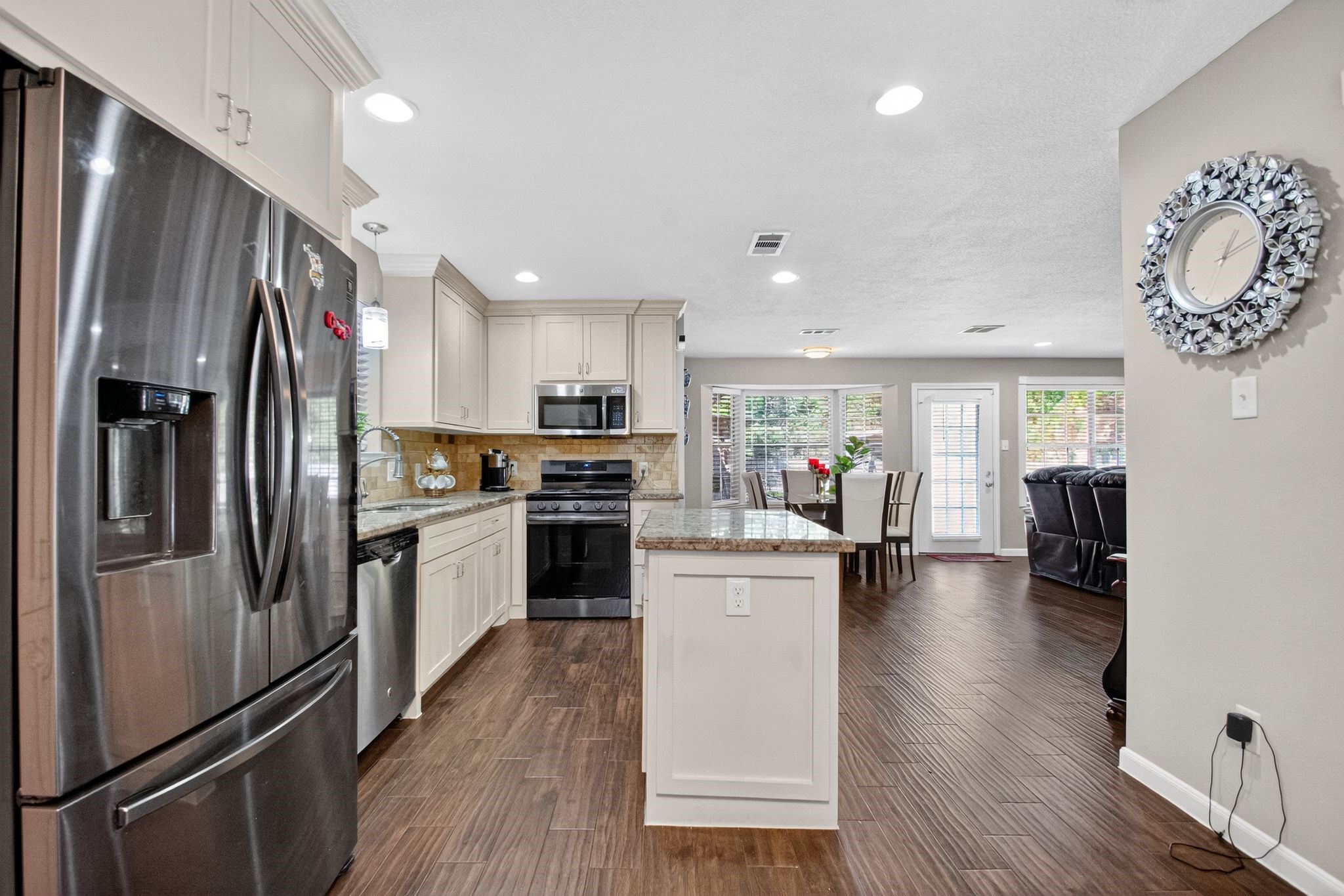 2514 Creekleaf Road Houston, TX 77068 - Photo 16 of 31 a kitchen with a refrigerator and a stove top oven