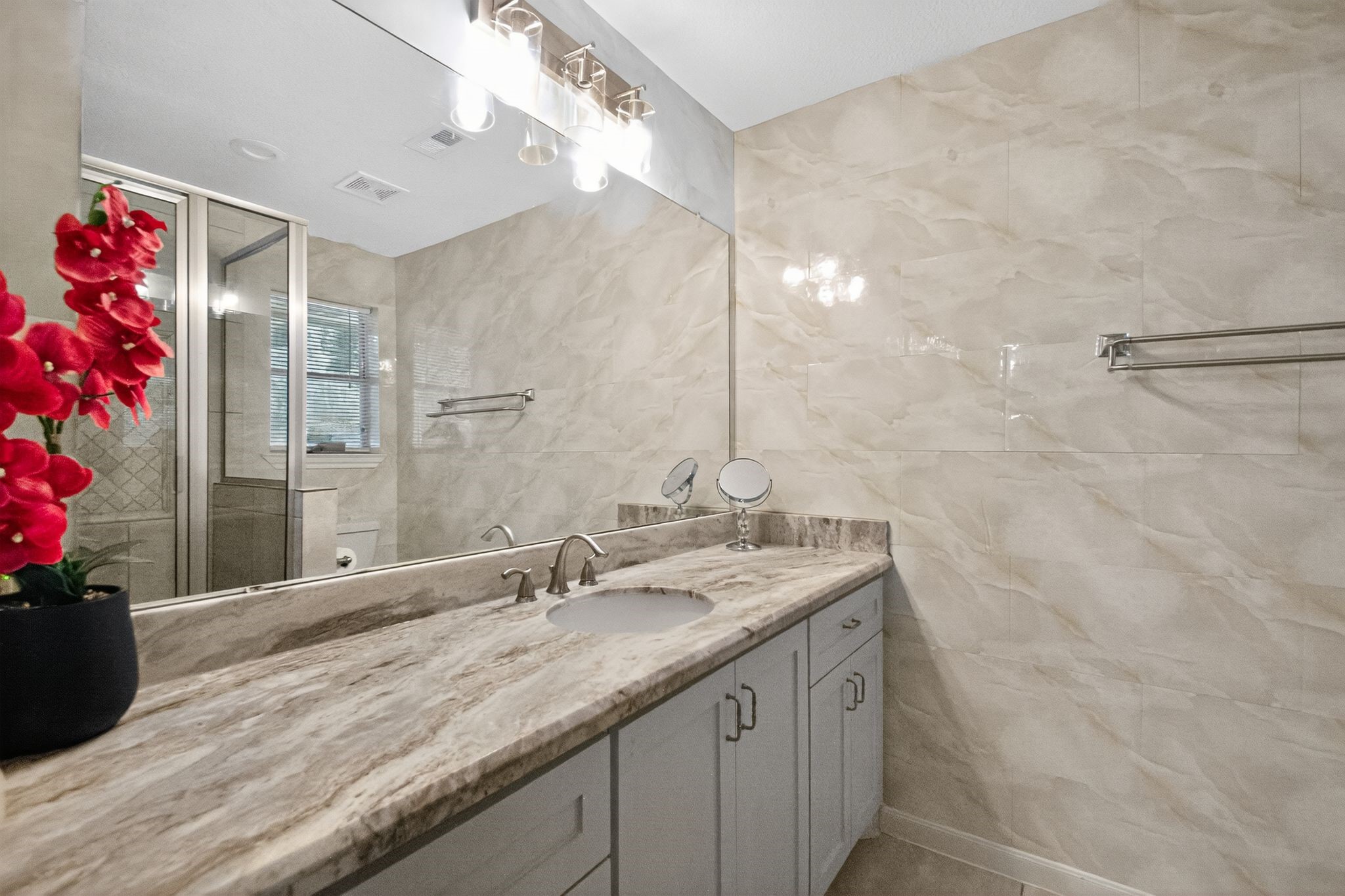 2514 Creekleaf Road Houston, TX 77068 - Photo 7 of 31 a bathroom with a granite countertop sink and a mirror