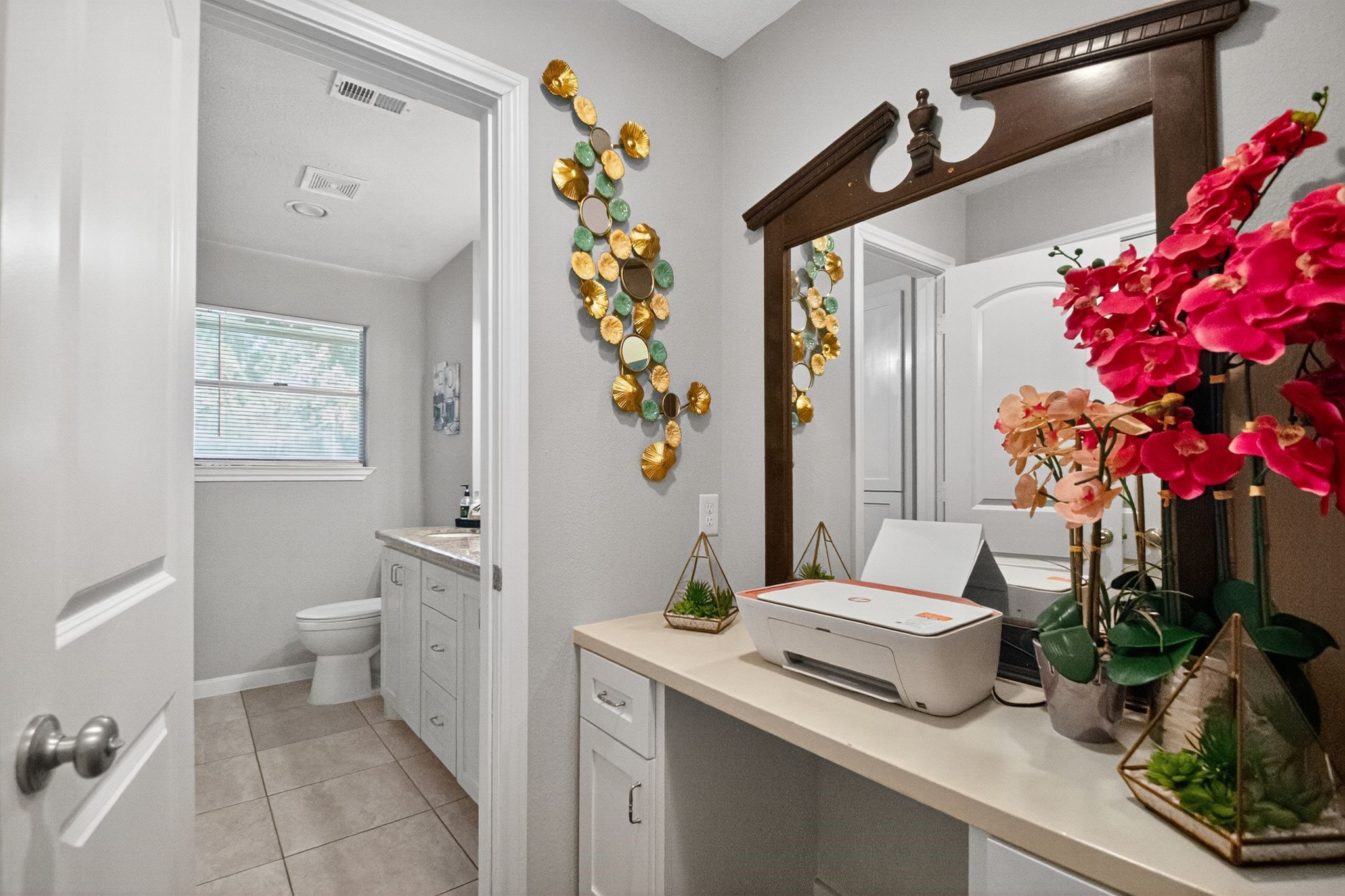 2514 Creekleaf Road Houston, TX 77068 - Photo 8 of 31 a view of bathroom with a toilet sink and mirror