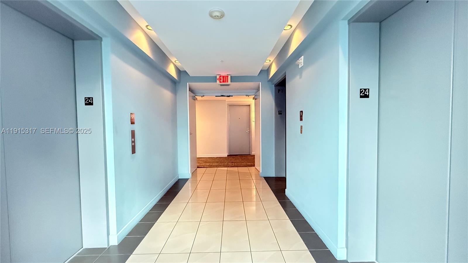300 South Biscayne Boulevard, Unit T2407 Miami, FL 33131 - Photo 16 of 49 a view of a hallway with wooden floor and staircase