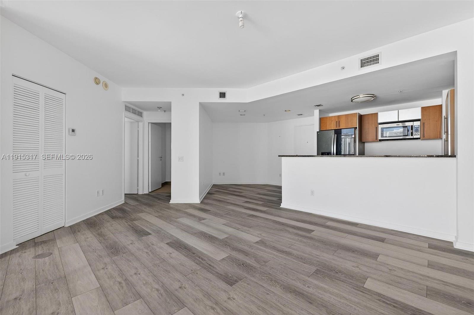 300 South Biscayne Boulevard, Unit T2407 Miami, FL 33131 - Photo 18 of 39 a view of a livingroom with wooden floor