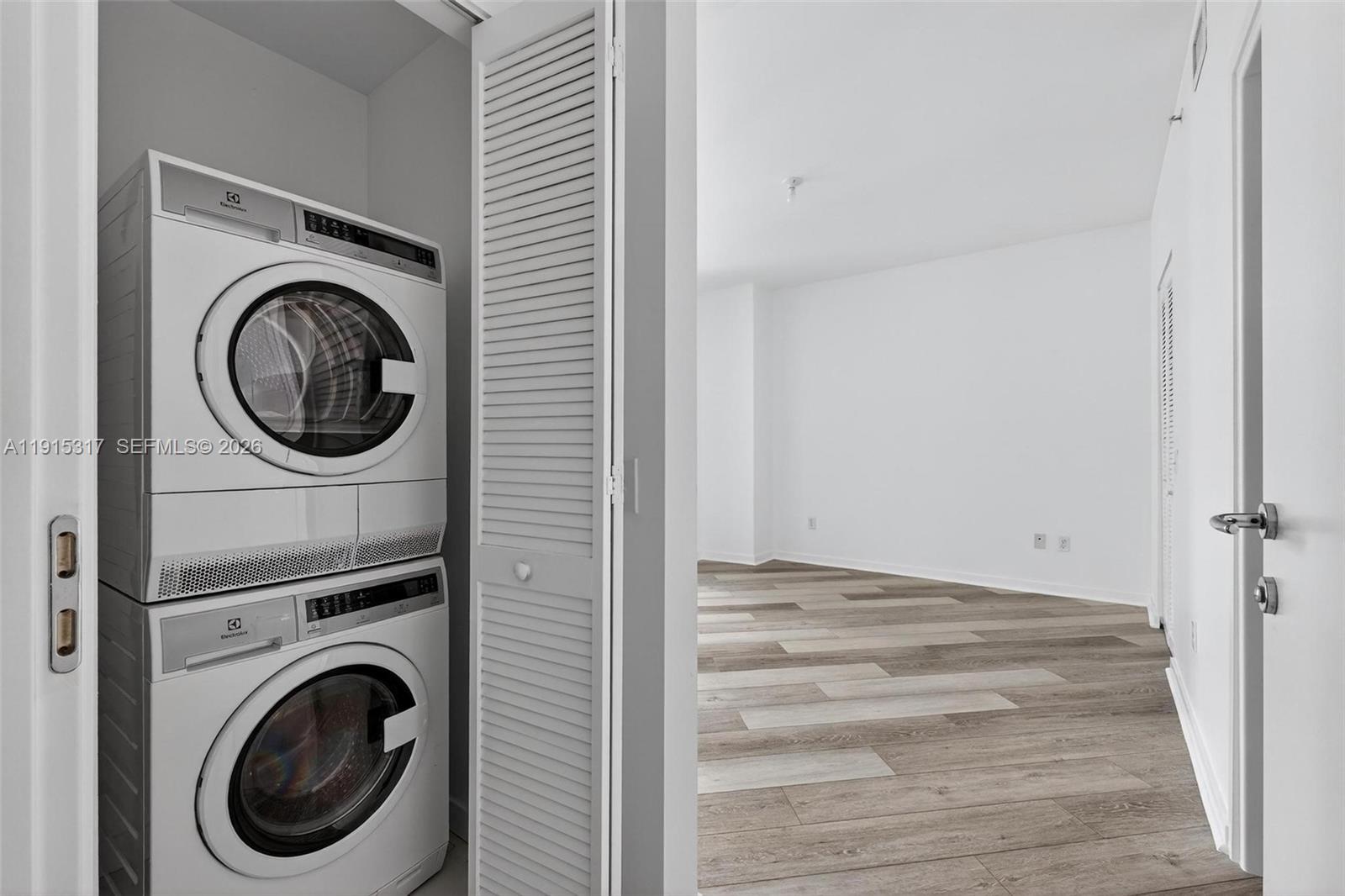 300 South Biscayne Boulevard, Unit T2407 Miami, FL 33131 - Photo 25 of 39 a view of a hallway with washer and dryer