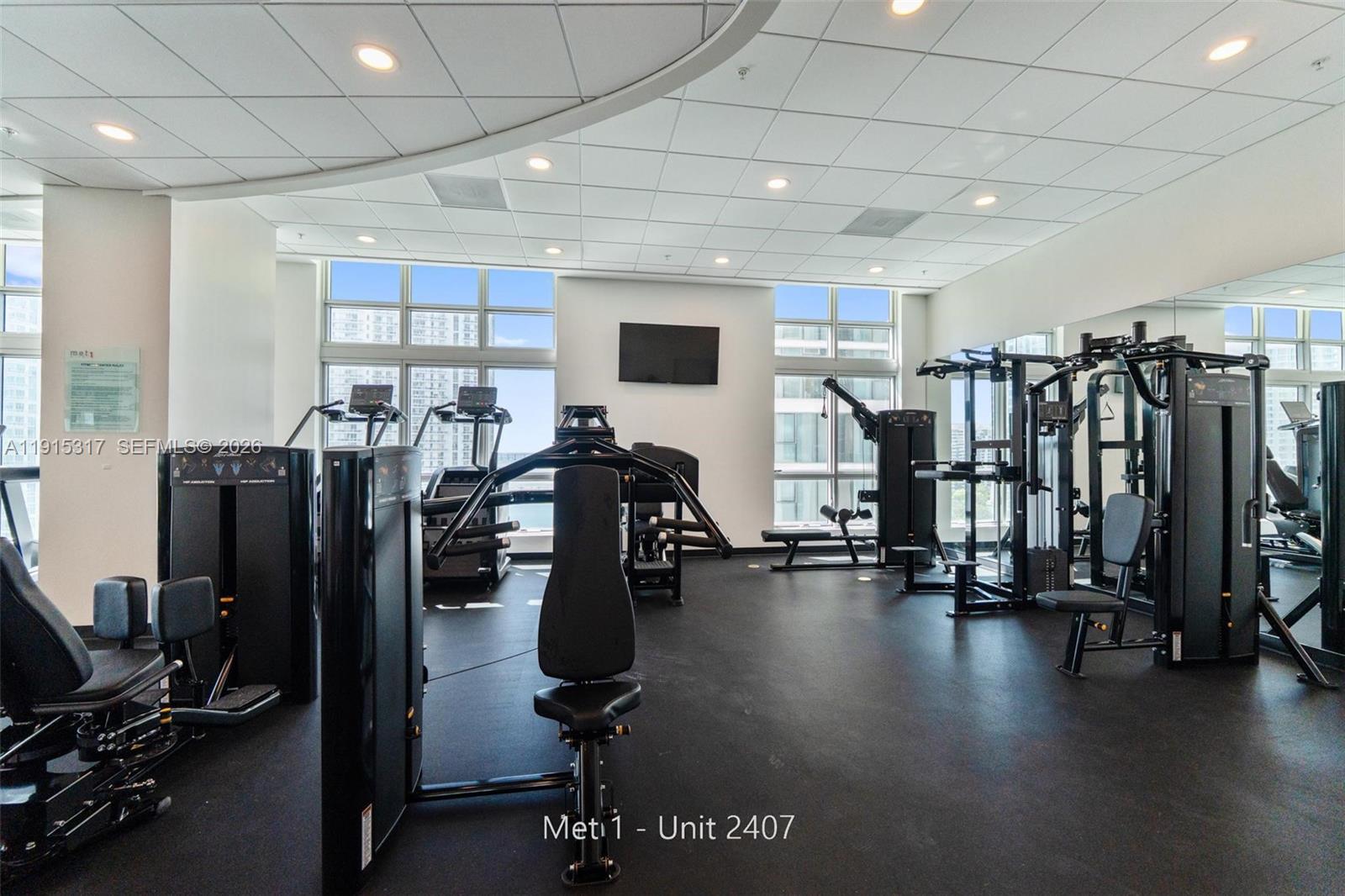 300 South Biscayne Boulevard, Unit T2407 Miami, FL 33131 - Photo 34 of 39 a view of a room with gym equipment