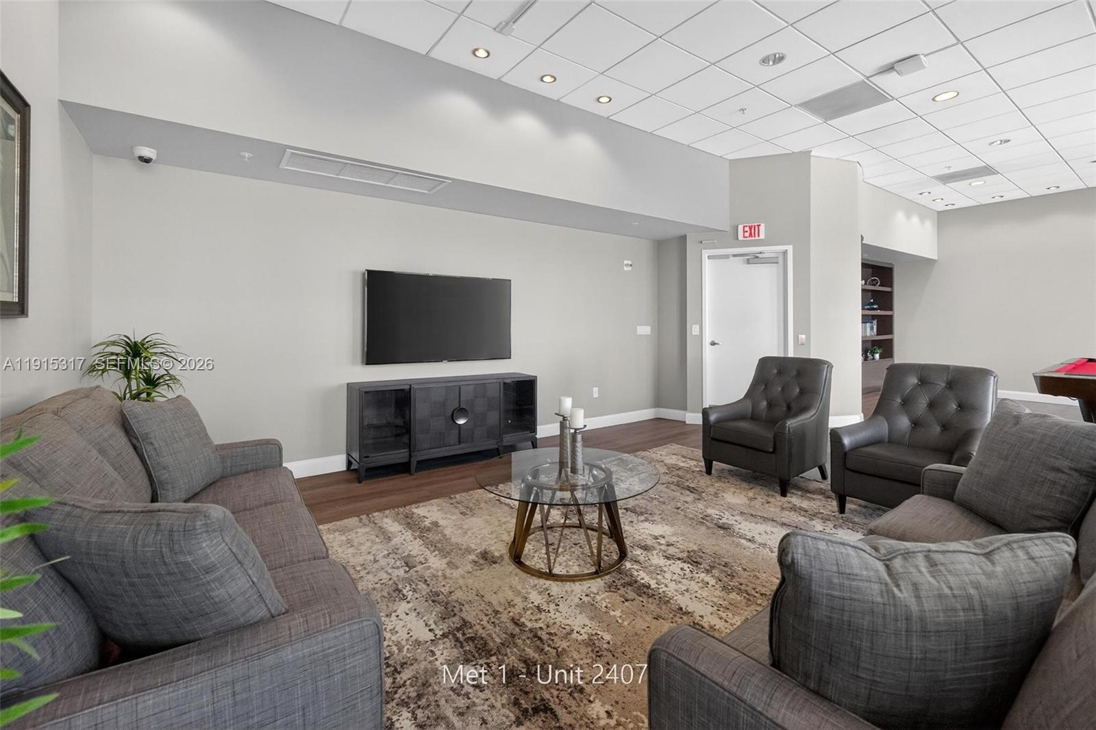 300 South Biscayne Boulevard, Unit T2407 Miami, FL 33131 - Photo 36 of 39 a living room with furniture and a flat screen tv