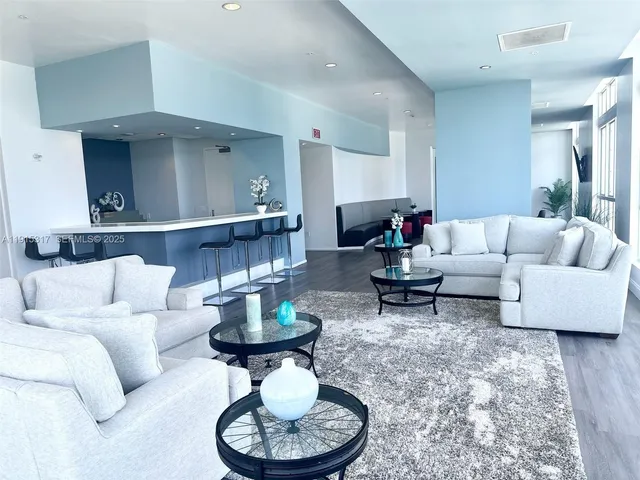 a room with furniture and wooden floor